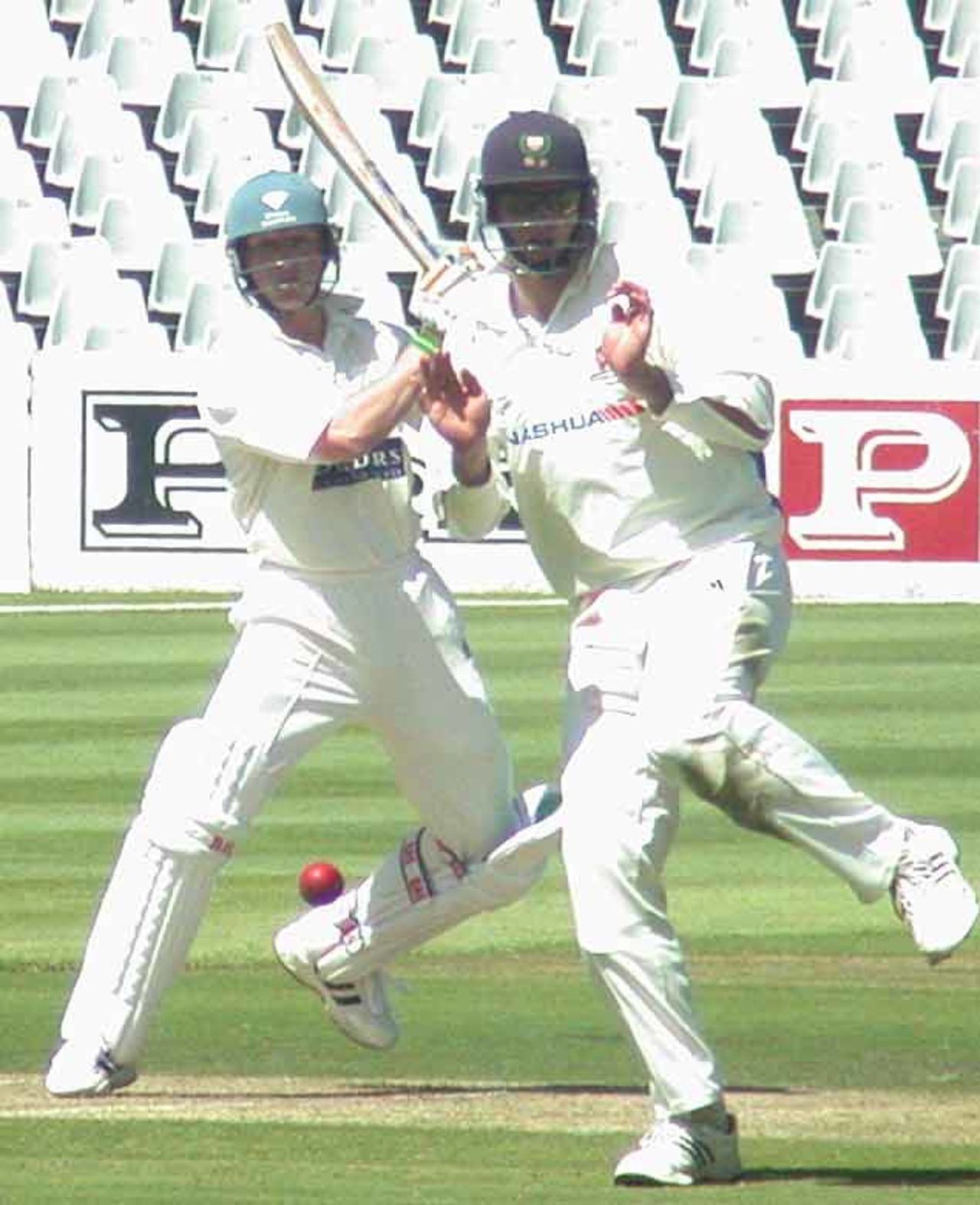Griqua's Brett Tucker drives a ball into the covers to reach his century against WP. The fielder is Graeme Smith