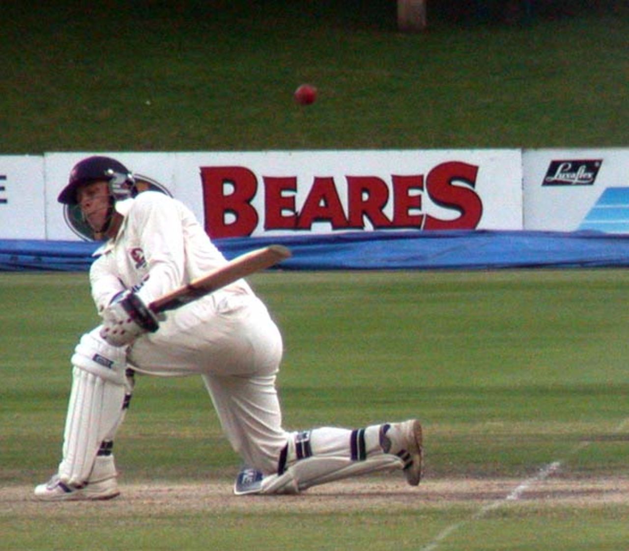 Jonathan Trott attempts to sweep a delivery to the square leg boundary