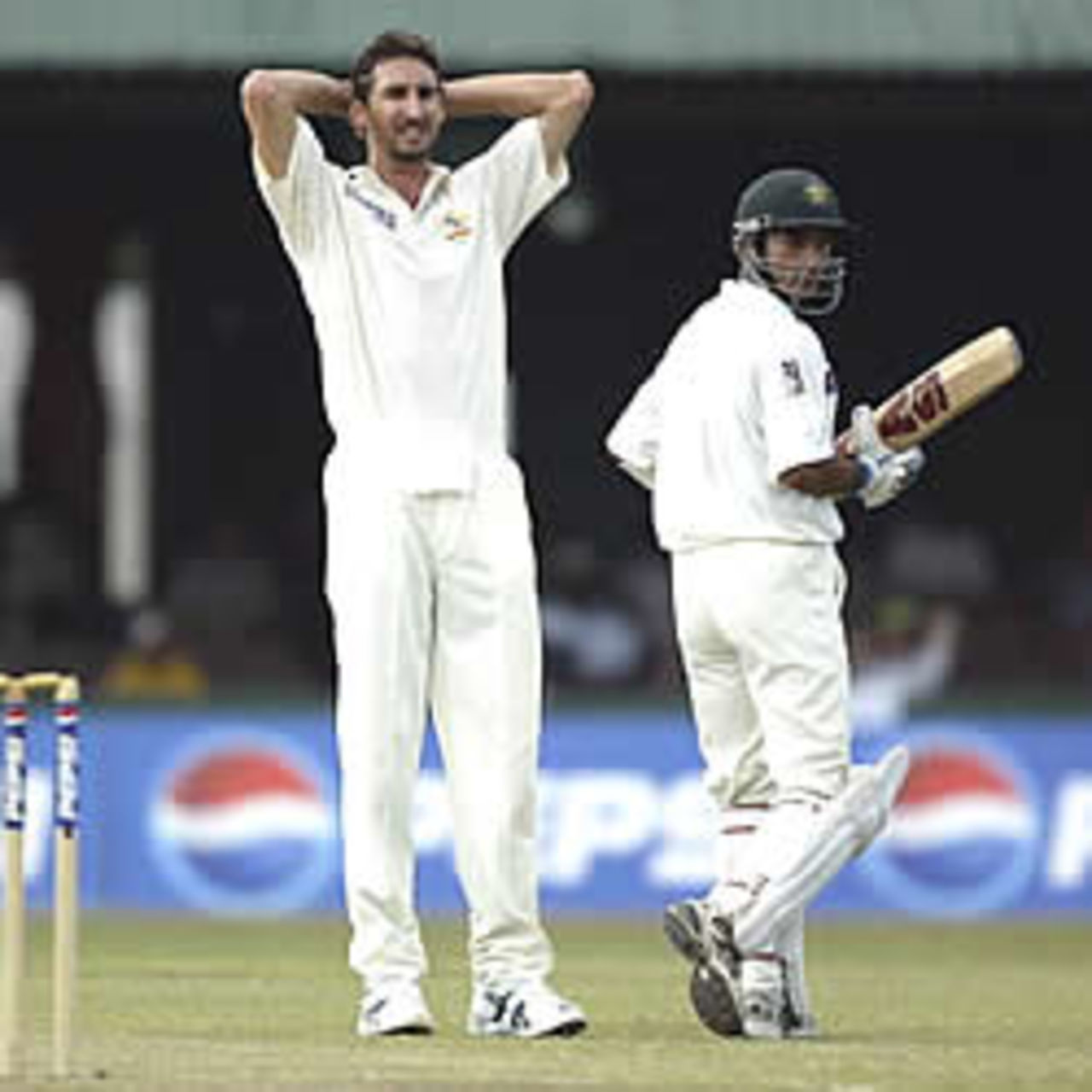COLOMBO - OCTOBER 6: Jason Gillespie of Australia shows his frustration as Taufeeq Umar of Pakistan continues to score during the first session of the fourth day of the first test match between Pakistan and Australia at the P.Saravanamuttu Stadium in Colombo, Sri Lanka on October 6, 2002.