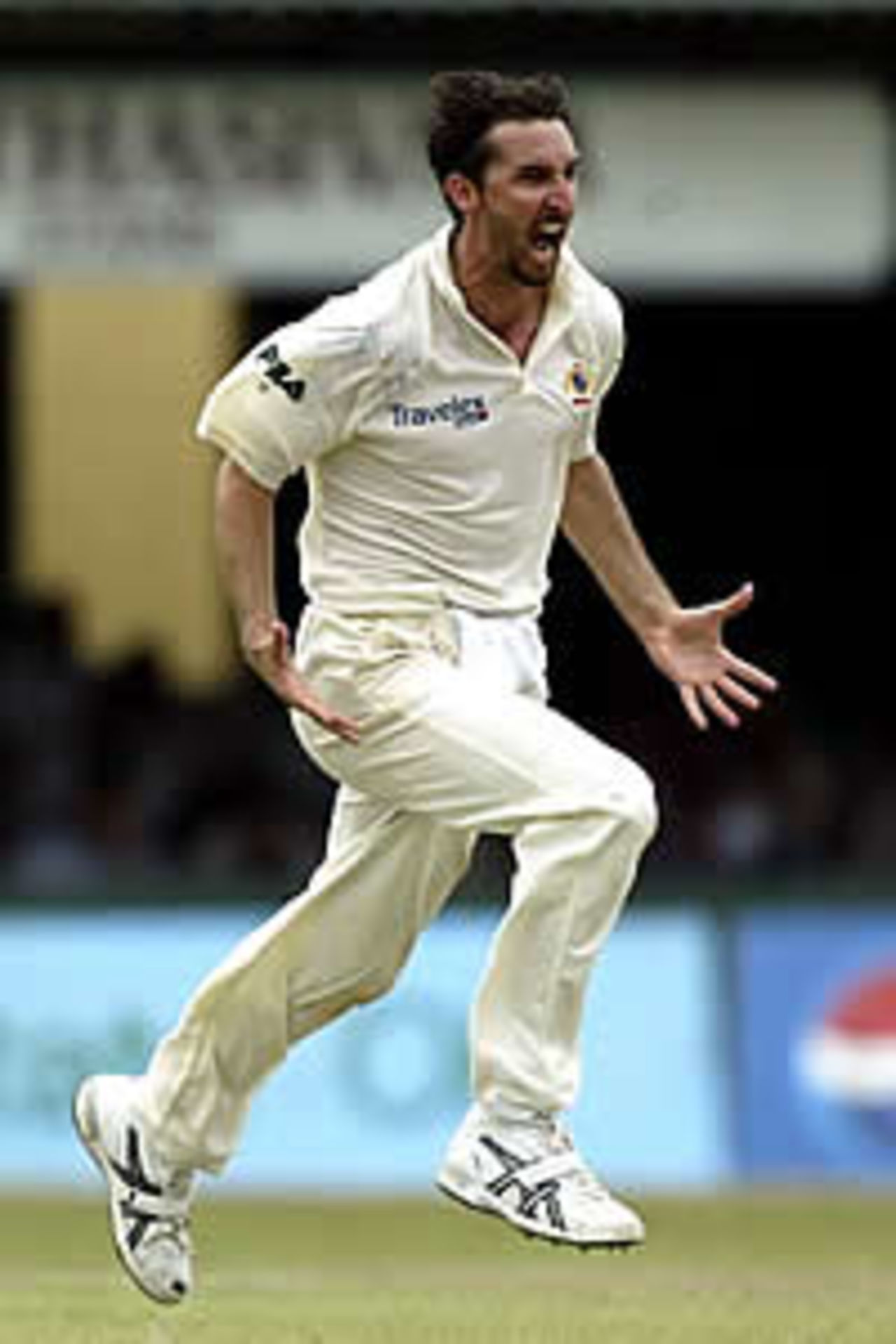 COLOMBO - OCTOBER 7: Jason Gillespie of Australia celebrates dismissing Waqar Younis of Pakistan during the fifth day of the first test match between Pakistan and Australia at the P.Saravanamuttu Stadium in Colombo, Sri Lanka on October 7, 2002.