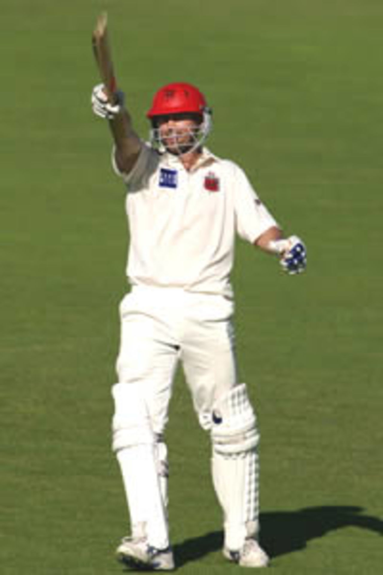 ADELAIDE - OCTOBER 16: Ben Johnson salutes his teammates on reaching his century in the Pura Cup match between the South Australian Redbacks and the Victoria Bushrangers played at Adelaide Oval in Adelaide, Australia on October 16, 2002.