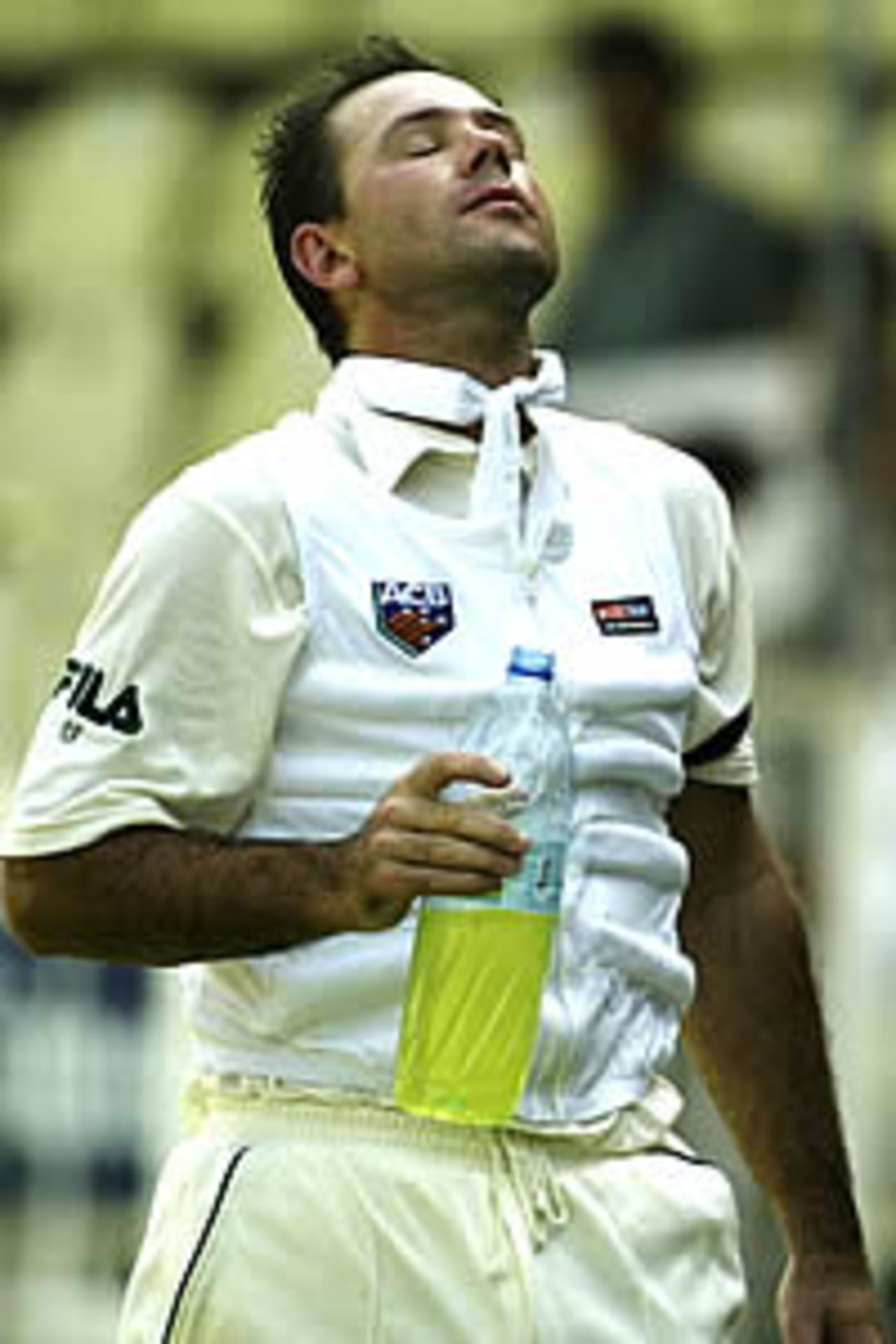 SHARJAH - OCTOBER 19: Ricky Ponting of Australia wears an ice vest to combat the heat during a drinks break on day one of the Third Test between Pakistan and Australia, played at Sharjah International Cricket Stadium in Sharjah, United Arab Emirates on October 19, 2002.