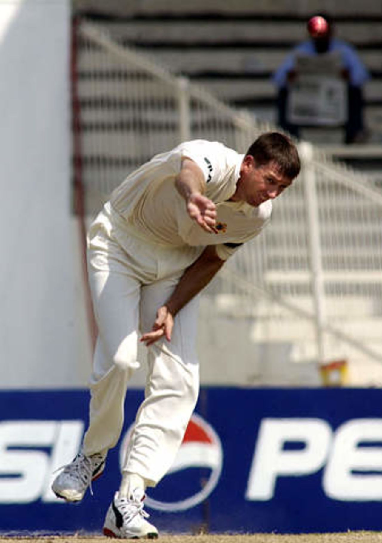 Australian bowler Glenn Mcgrath in action against Pakistan on the third day of the third Test in Sharjah Cricket Stadium October 21, 2002. McGrath took his 400 test wicket when he dismissed Pakistan captain Waqar Younis.