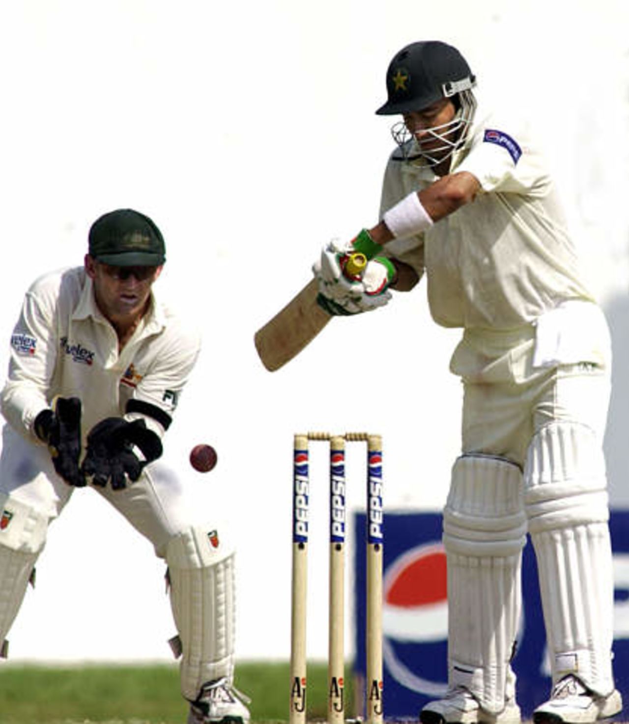 Pakistan batsman Hasan Raza (R) the highest scorer in action against Australia on the third day of the third Test in Sharjah Cricket Stadium on October 21, 2002.