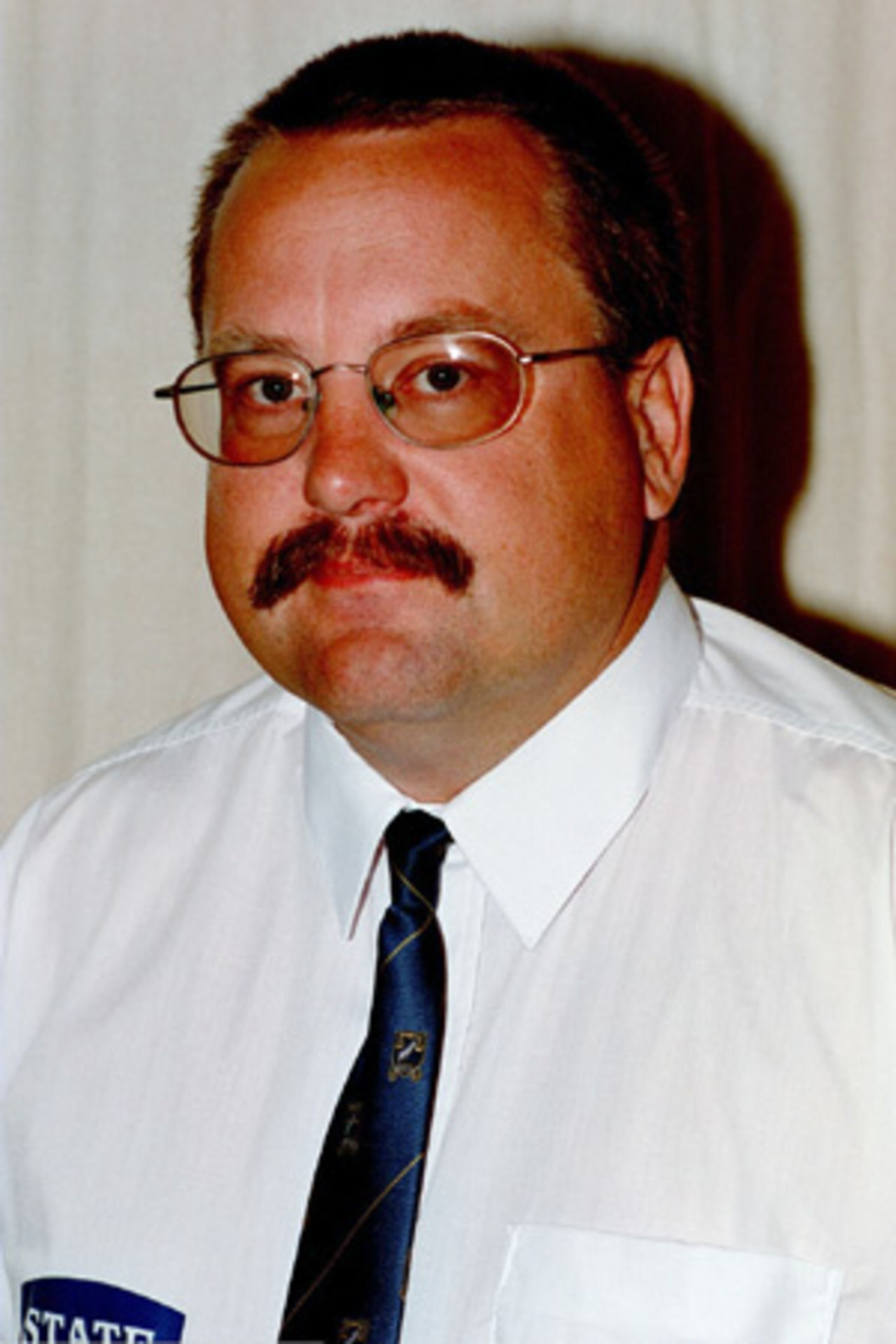 Portrait of Dave Paterson, New Zealand reserve panel umpire in the 2002/03 season.