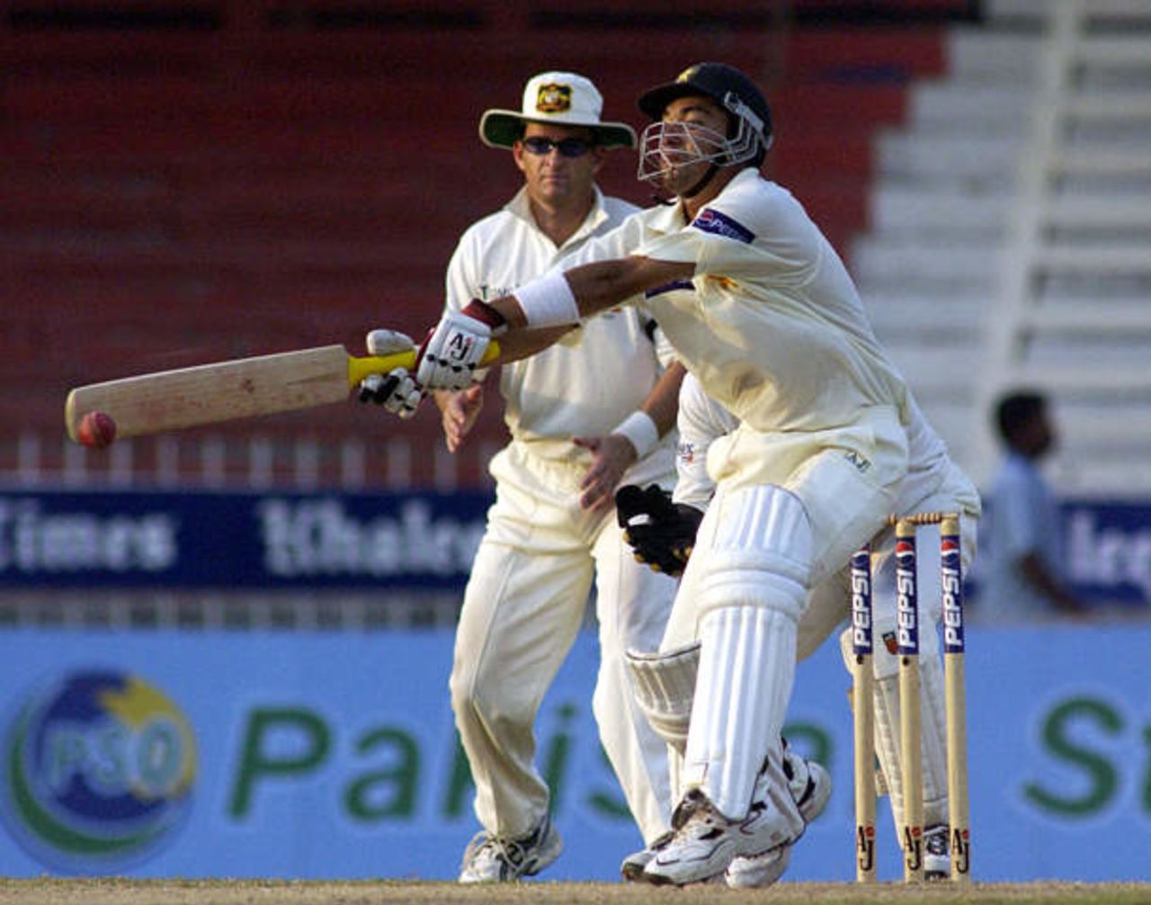 Hasan Raza, the Pakistan's batsman and a highest scorer of the match, hits the ball on his way to second succesive half century of the day against Australia on the third day of the third Test in Sharjah Cricket Stadium on October 21, 2002.
