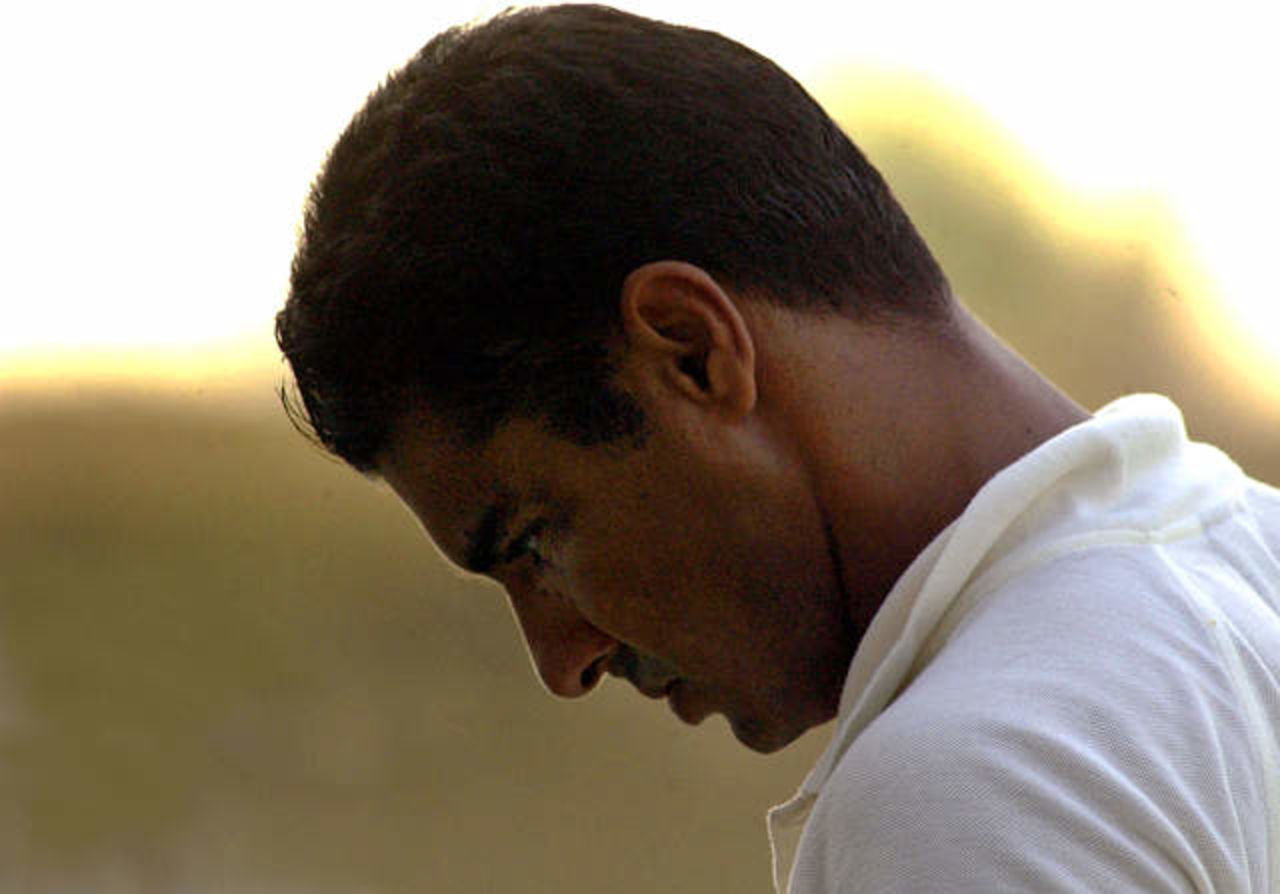 Pakistan captain Waqar Younis walks off the field during his team's match against Australia on the third day of the third Test in Sharjah Cricket Stadium October 21, 2002. Australian paceman Glenn McGrath, thrilled to reach the 400-wicket mark in his test career during the third test with Pakistan on Monday, is already eyeing 500. McGrath, 32, joined an elite of eight bowlers, headed by Courtney Walsh on 519, when he dismissed Waqar Younis in the Pakistani first innings.