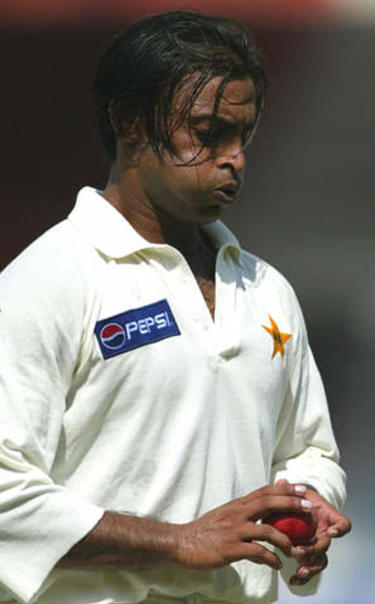Pakistan fast bowler Shoaib Akhtar prepares to bowl against Australia's Matthew Hayden at Sharjah's stadium October 12, 2002 on the second day of their second cricket test match. The second and third tests are being held in the neutral venue of Sharjah after Australia balked at playing in Pakistan due to security concerns.