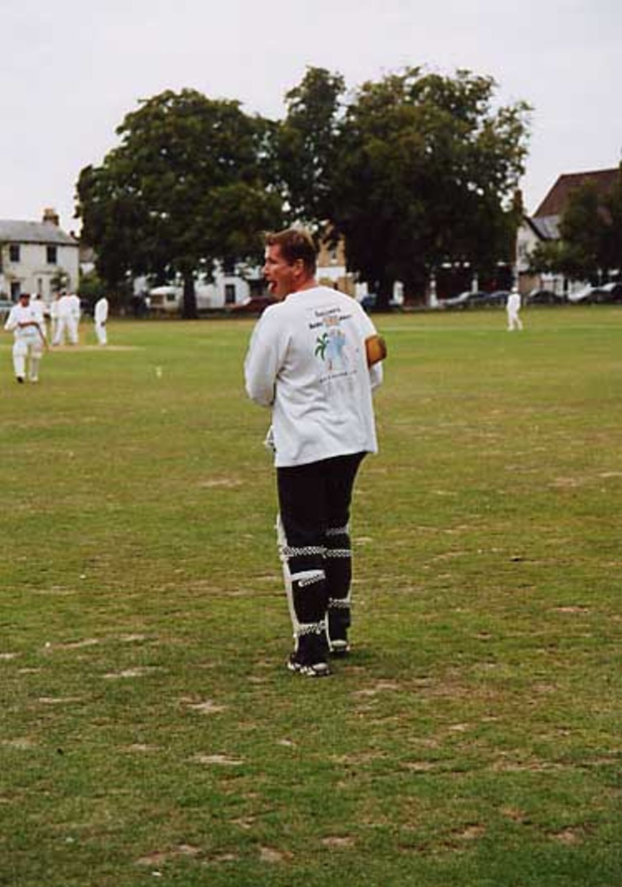 Number 15 batsman Leafy strides to the wicket, Twickenham