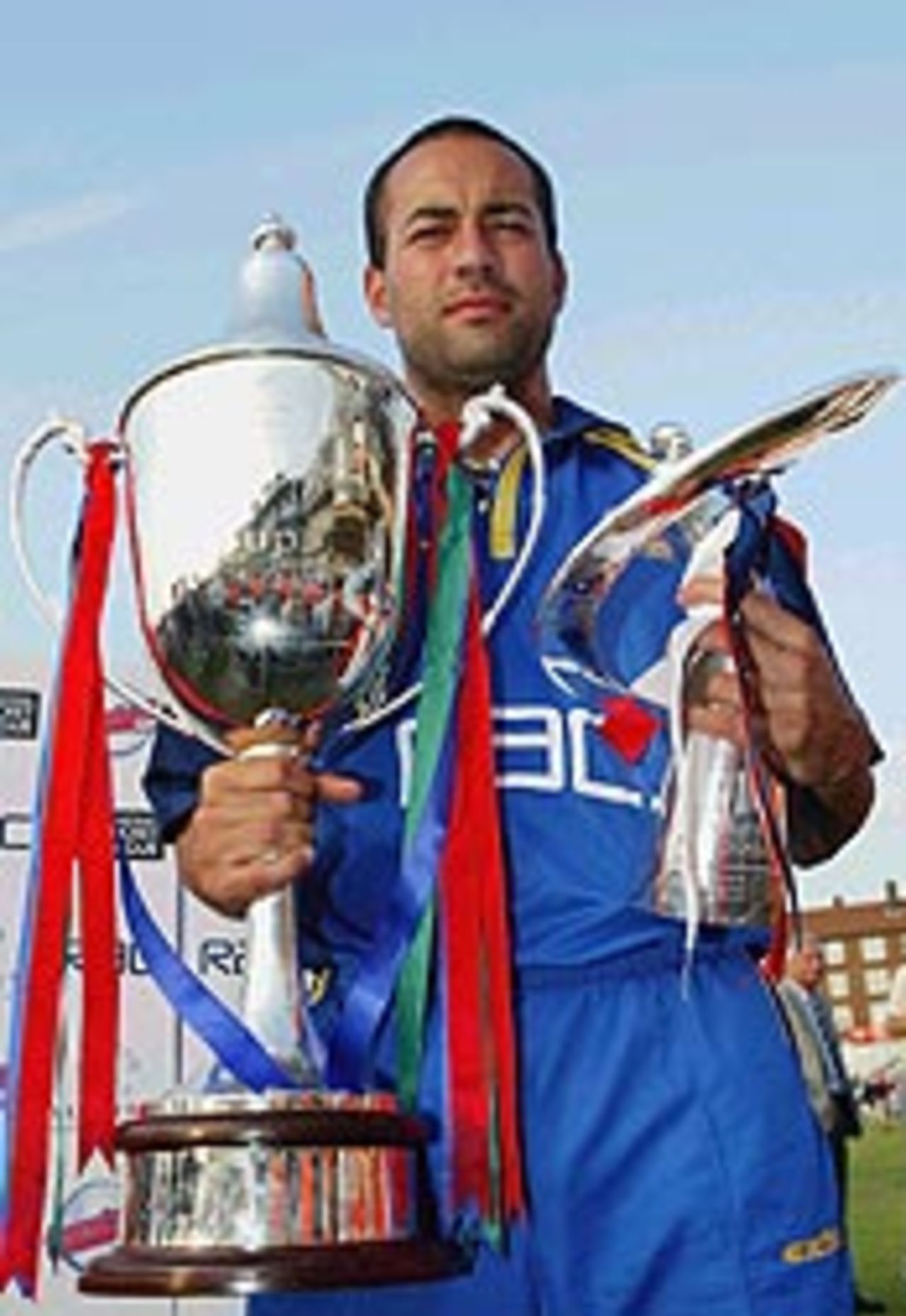 Adam Hollioake celebrates with the National League and Twenty20 Cups, 2003