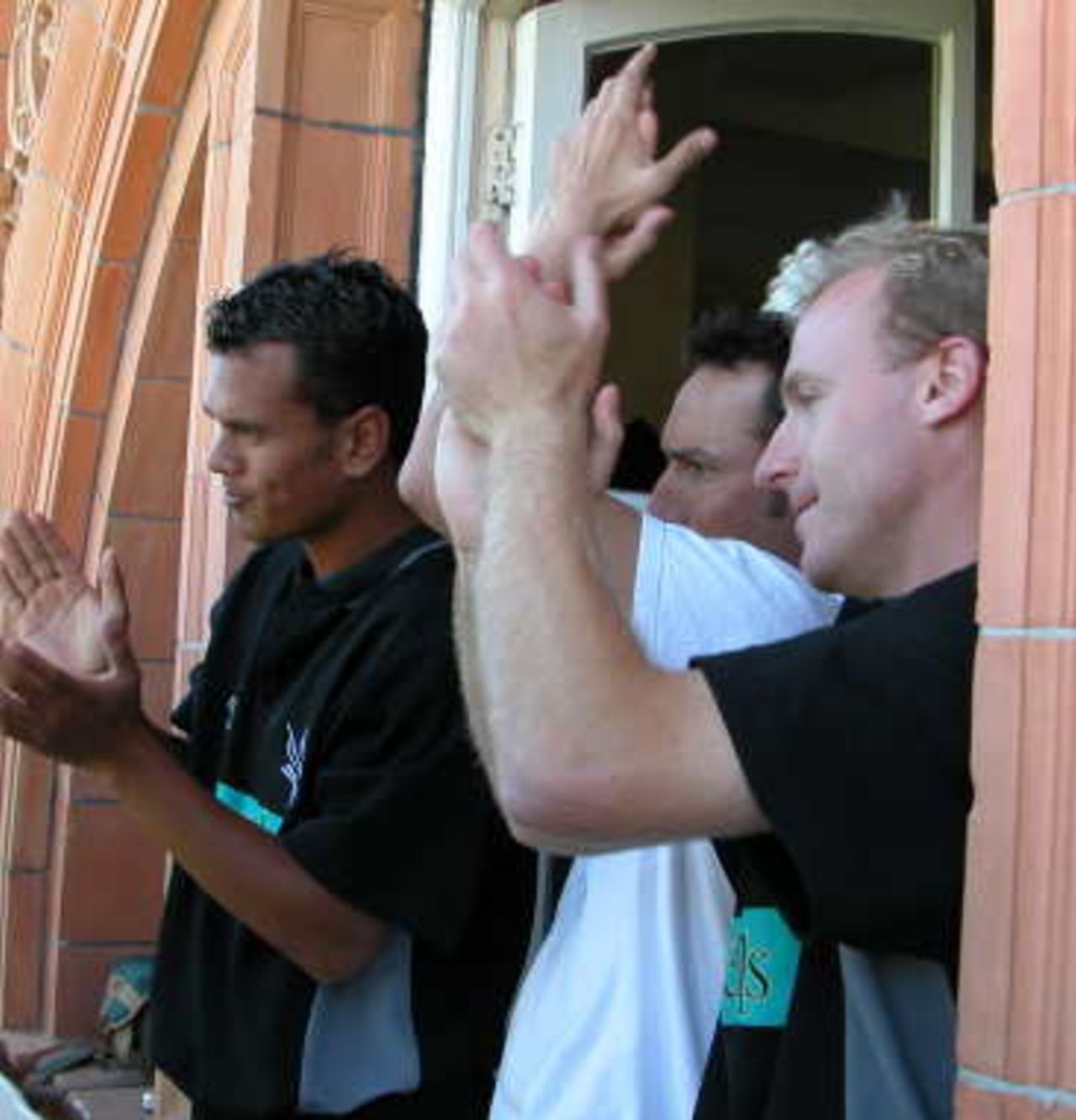 Hampshire Hawks players applaud Simon Katich's century at Lord's