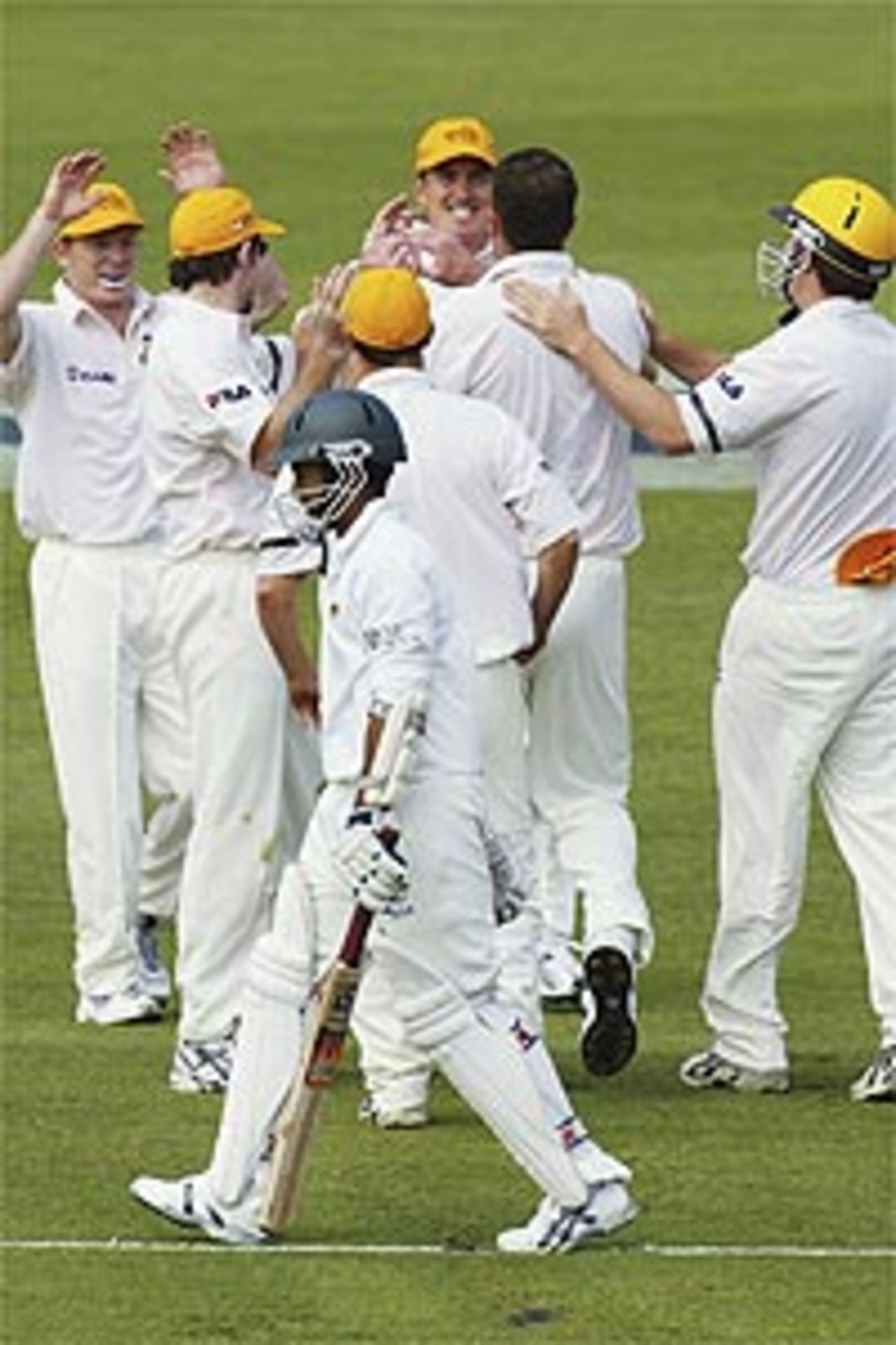 The Western Australian Team celebrate the wicket of Dion Ebrahim of Zimbabwe during day one of the tour match between Western Australia and Zimbabwe played at the WACA on October 3, 2003 in Perth, Australia.