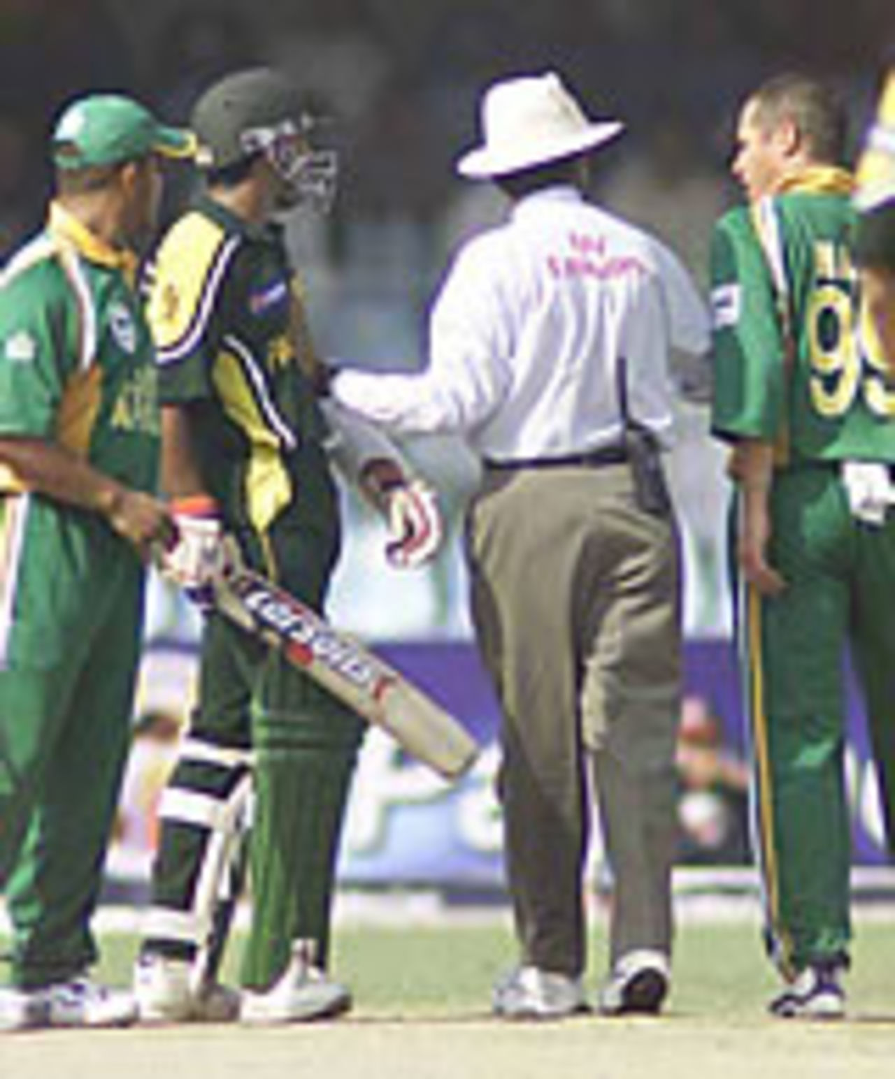 Umpire Nadeem Ghauri steps in to stop an altercation between Andrew Hall and Yousuf Youhana, Lahore, ODI2, Pakistan v South Africa, October 5, 2003.