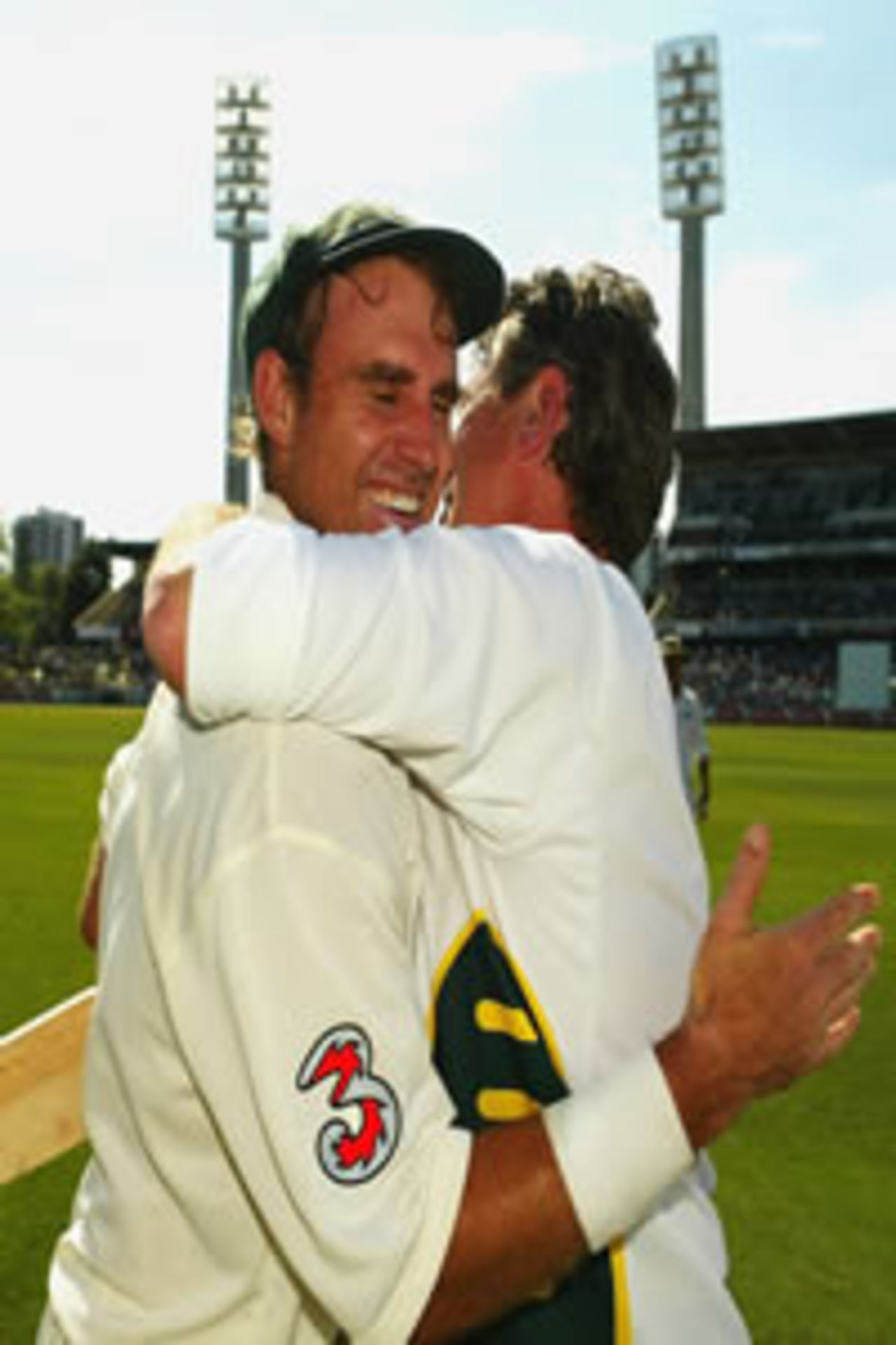 Matthew Hayden of Australia is congratulated by physio Errol Alcott after breaking Brian Lara of The West Indies world record of 375 during day two of the First Test between Australia and Zimbabwe played at the WACA Ground on October 10, 2003 in Perth, Australia.