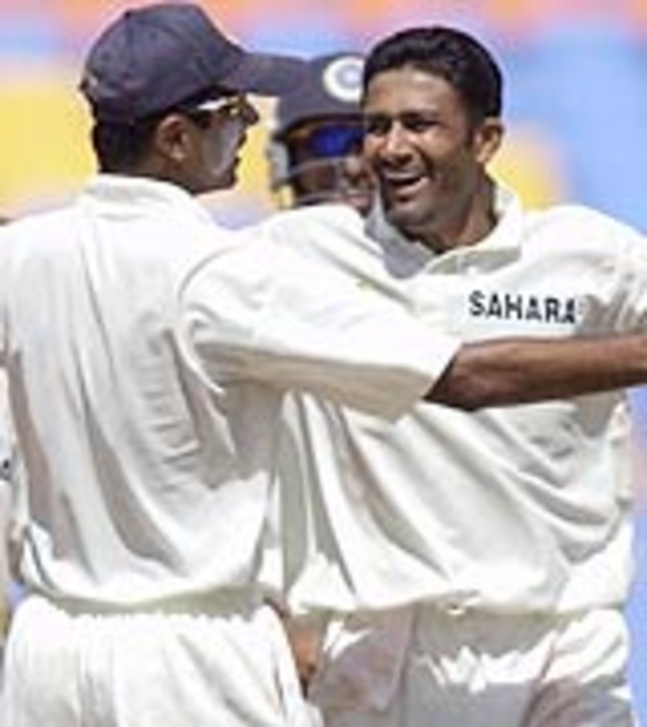 Anil Kumble celebrates the fall of Lou Vincent's wicket with Rahul Dravid in the first Test against New Zealand in Ahmedabad, October 12, 2003