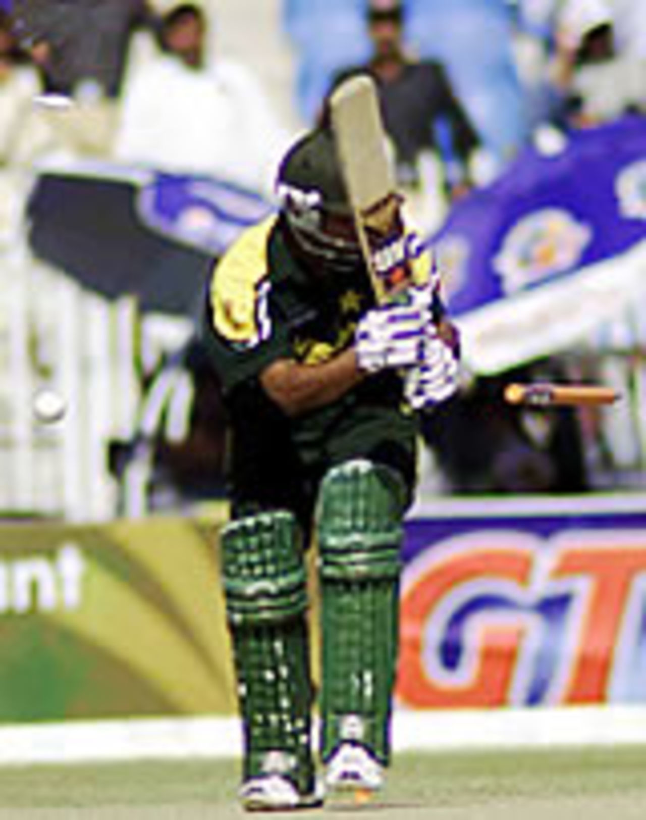 Mohammad Hafees surrounded by a bail, ball and stump after being bowled by Andre Nel, Pakistan v South Africa, 5th ODI, Rawalpindi, October 12, 2003.