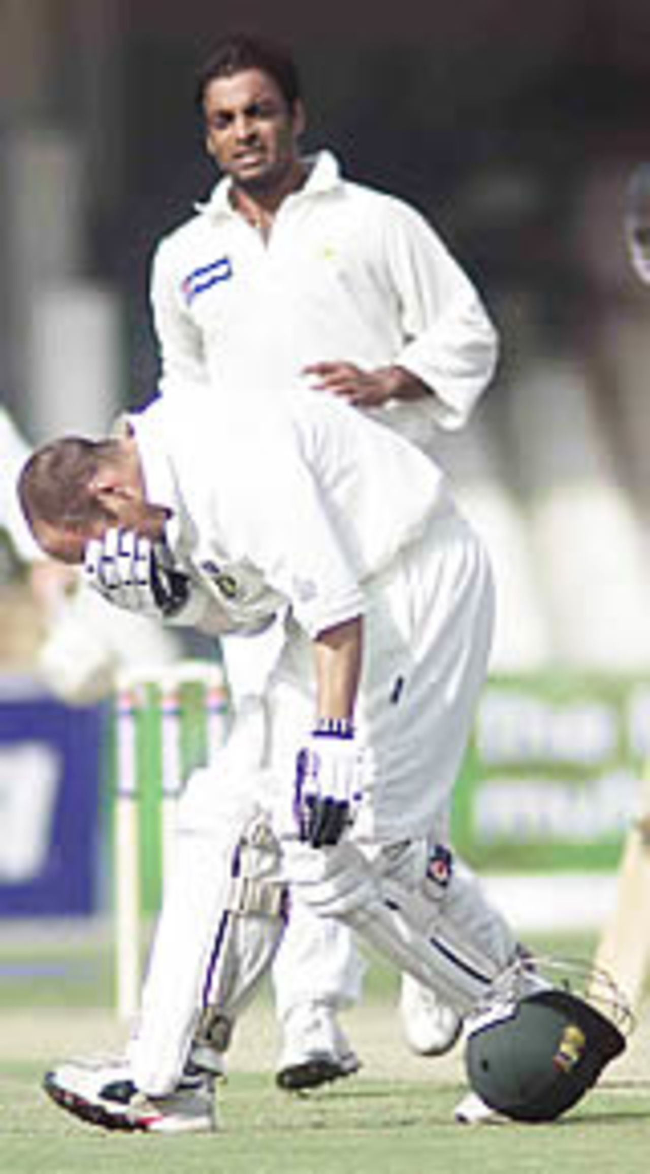 Gary Kirsten in pain after being struck on the face as Shoaib Akhtar shows his anxiety, Pakistan v South Africa, Day 1, 1st Test, Lahore, October 17, 2003.