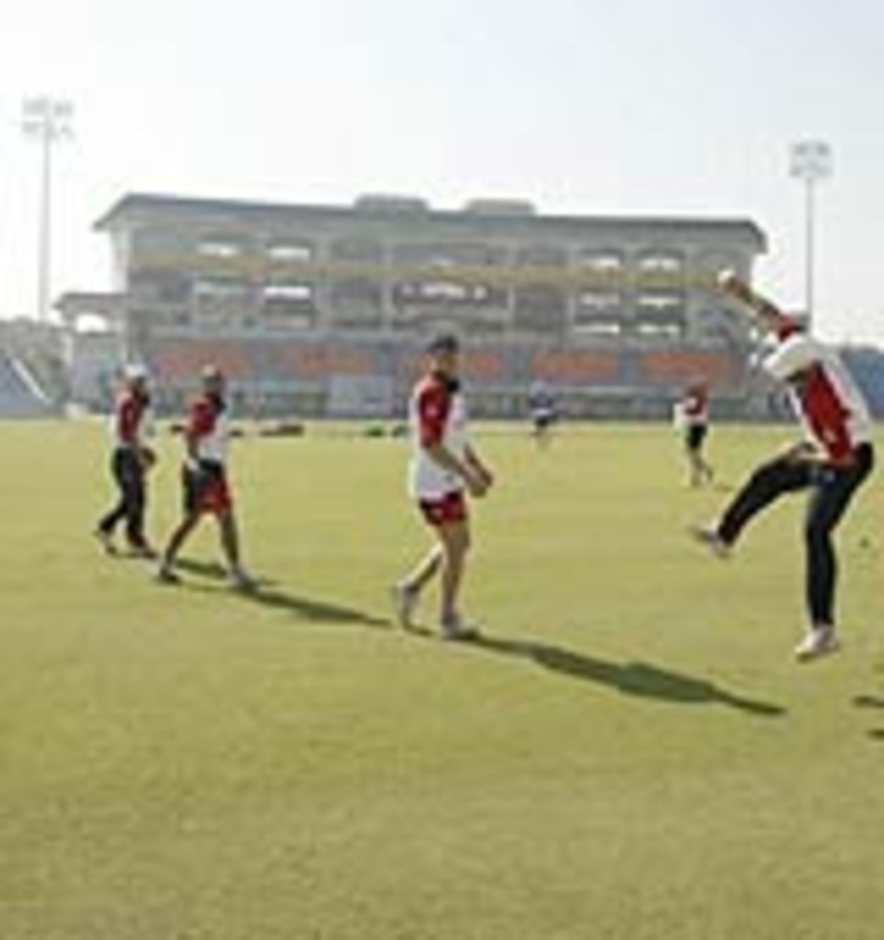Cricketers practice at the PCA Stadium in Mohali
