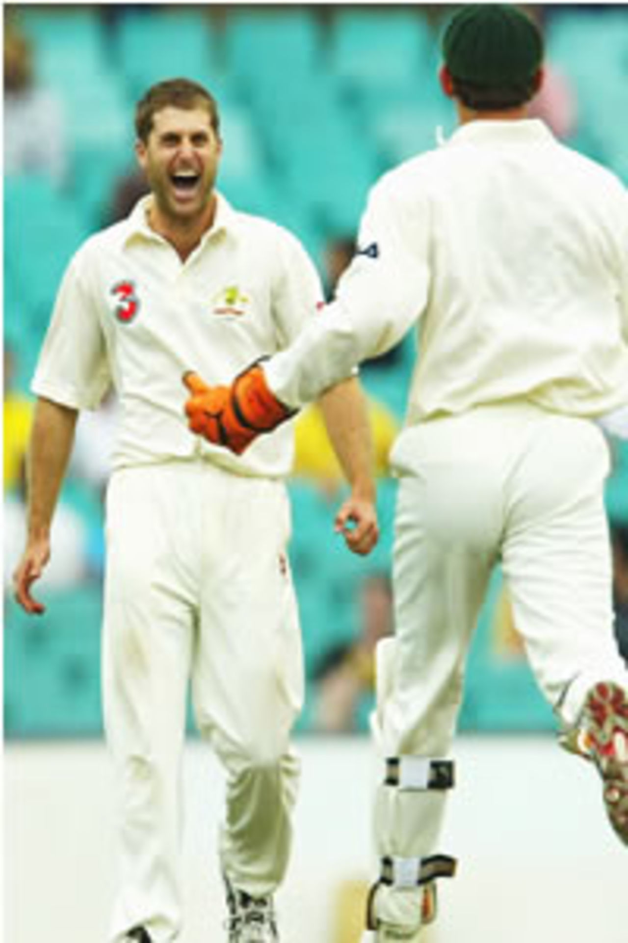 Simon Katich of Australia celebrates the wicket of Stuart Carlisle of Zimbabwe during day three of the 2nd Test between Australia and Zimbabwe played at the SCG on October 19, 2003 in Sydney, Australia