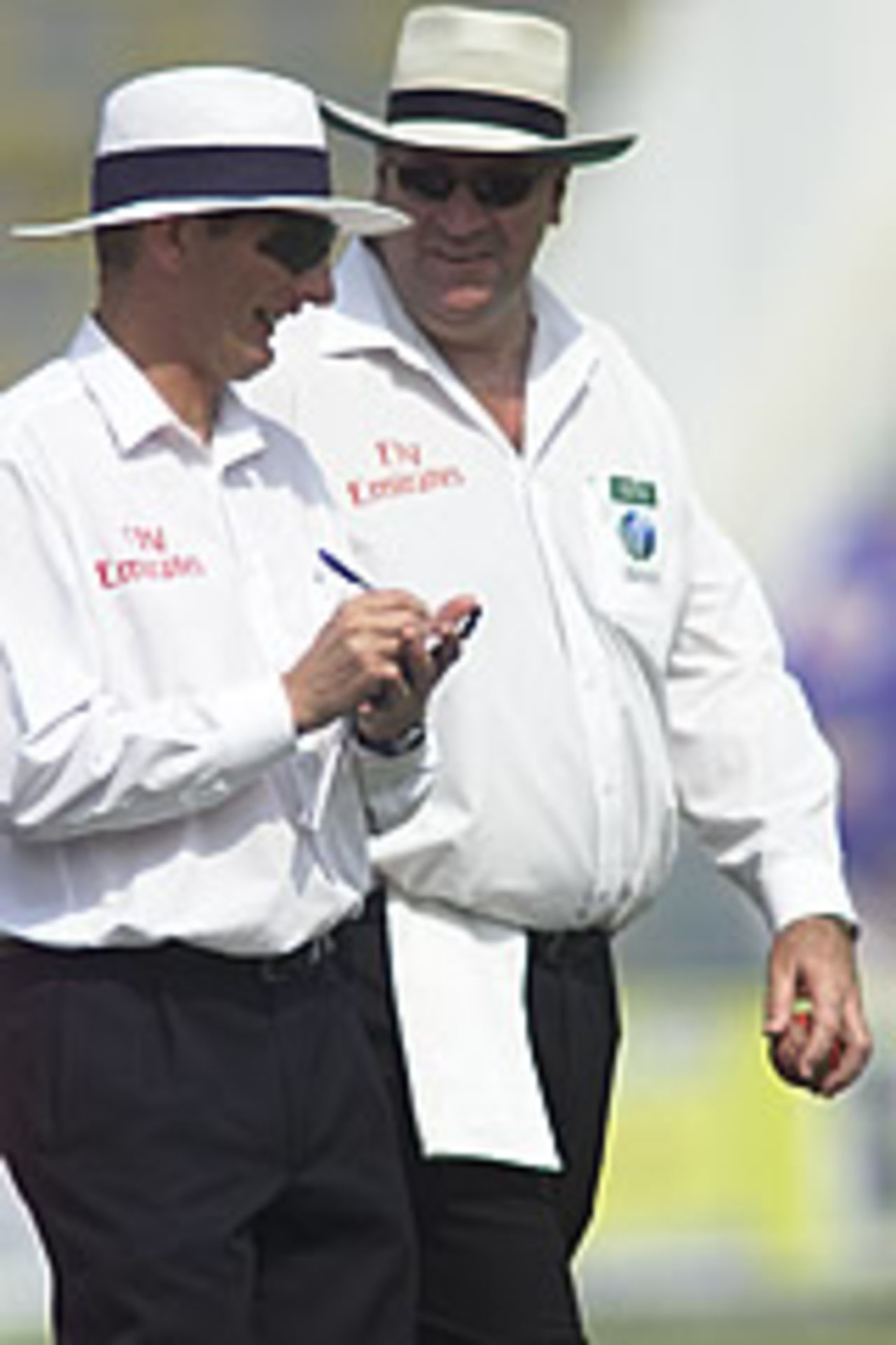Umpires Darrel Hair and Neil Mallender enjoying a light moment, Pakistan v South Africa, Day 3, 1st Test, Lahore, October 19, 2003.