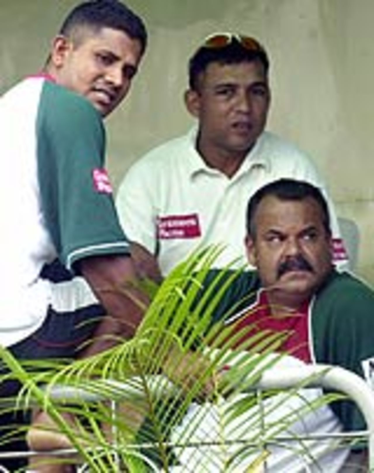Mushfiqur Rahman, Khaled Mahmud and Bangladesh coach Dav Whatmore watch the rain fall, Bangladesh v England, 1st Test, Dhaka, October 21, 2003