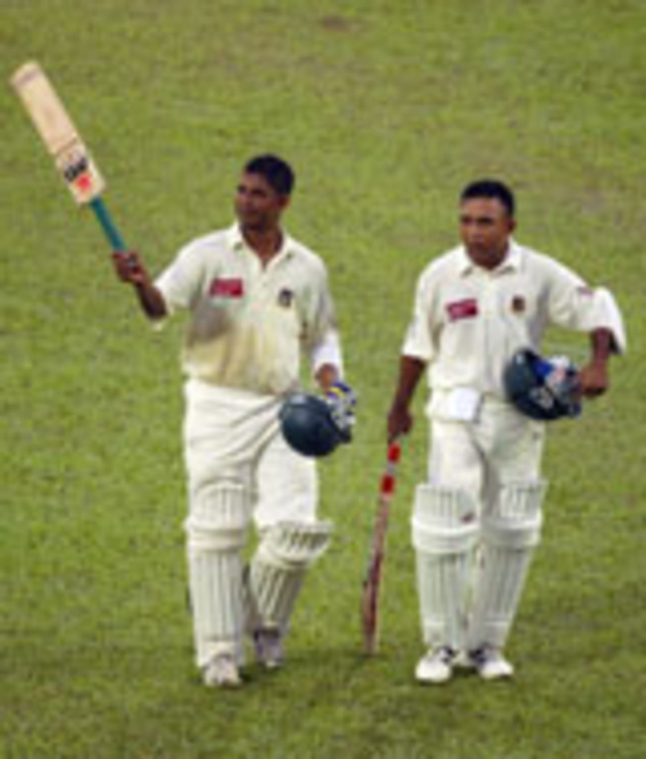 Mushfiqur Rahman and Khaled Mahmud walk off after play, Bangladesh v England, 1st Test, Dhaka, October 24, 2003
