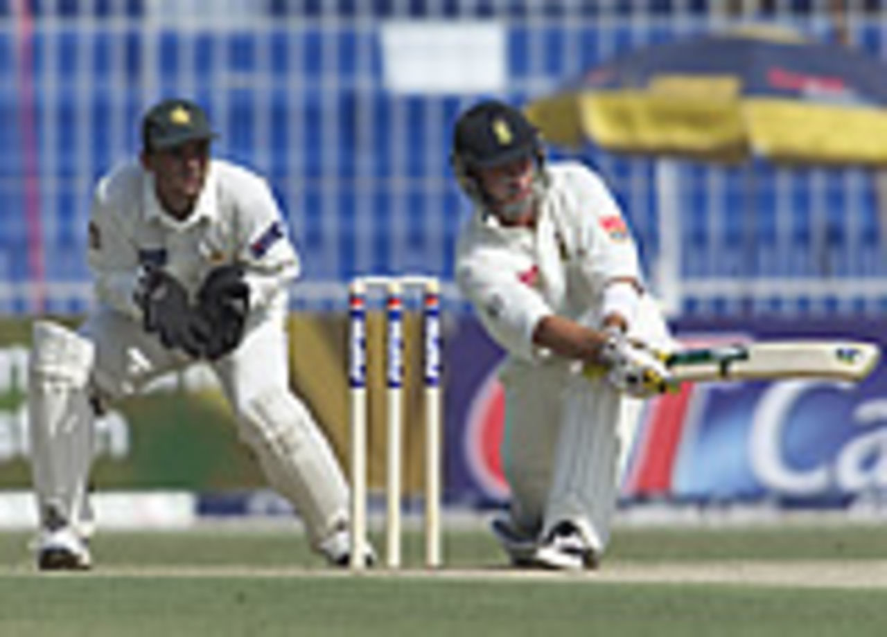 Herchelle Gibbs sweeps during his 98-run innings, Pakistan v South Africa, Day 1, 2nd Test, Faisalabad, October 20, 2003.