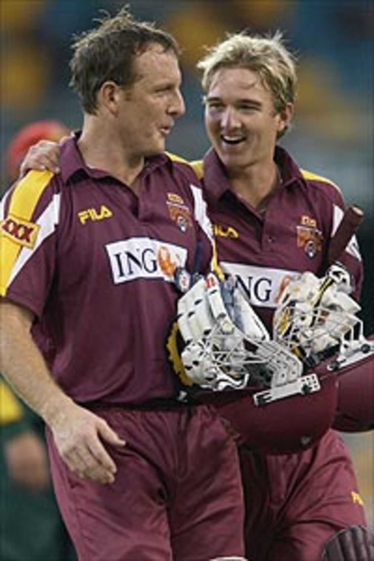 Wade Seccombe and Nathan Hauritz of the Bulls celebrate winning against the Tigers during the ING Cup match between the Queensland Bulls and the Tasmanian Tigers at the Gabba October 25, 2003 in Brisbane, Australia.