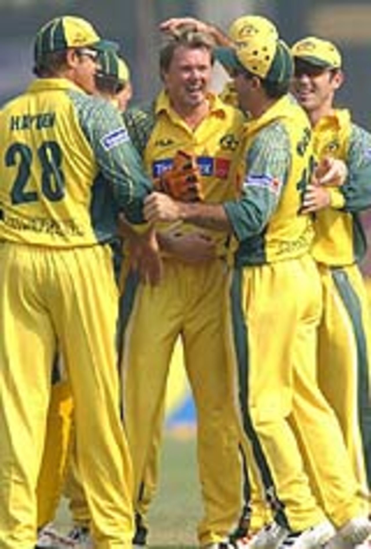 Team-mates congratulate Brad Williams for dismissing Scott Styris, Australia v New Zealand, Faridabad, October 29, 2003