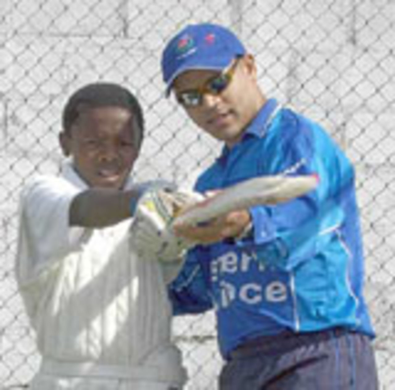 WP captain Ashwell Prince shows a young Gugulethu player how to hook