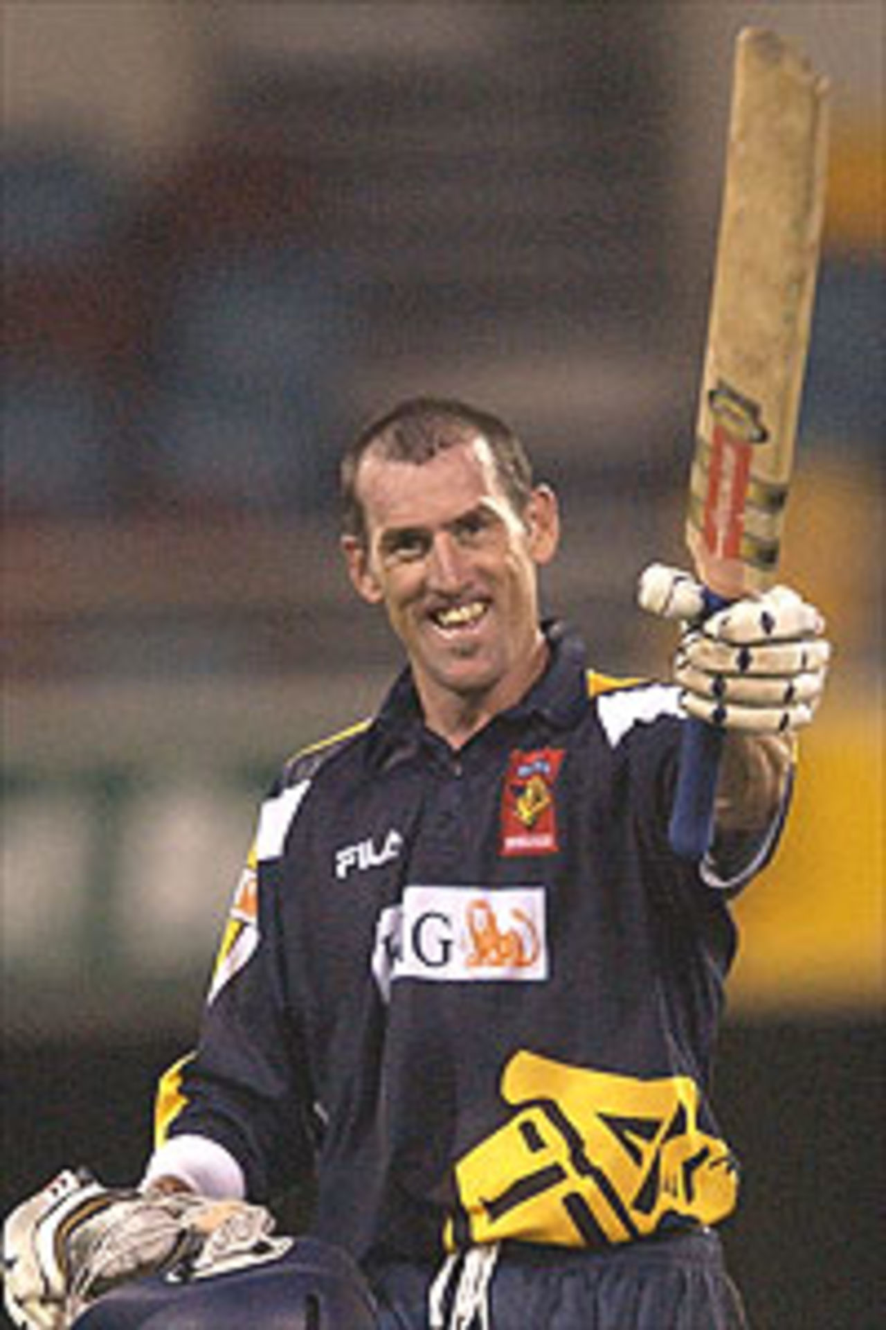 Matthew Elliott of the Bushrangers celebrates scoring a century against the Bulls during the ING Cup match between the Queensland Bulls and the Victoria Bushrangers at the Gabba October 31, 2003 in Brisbane, Australia.