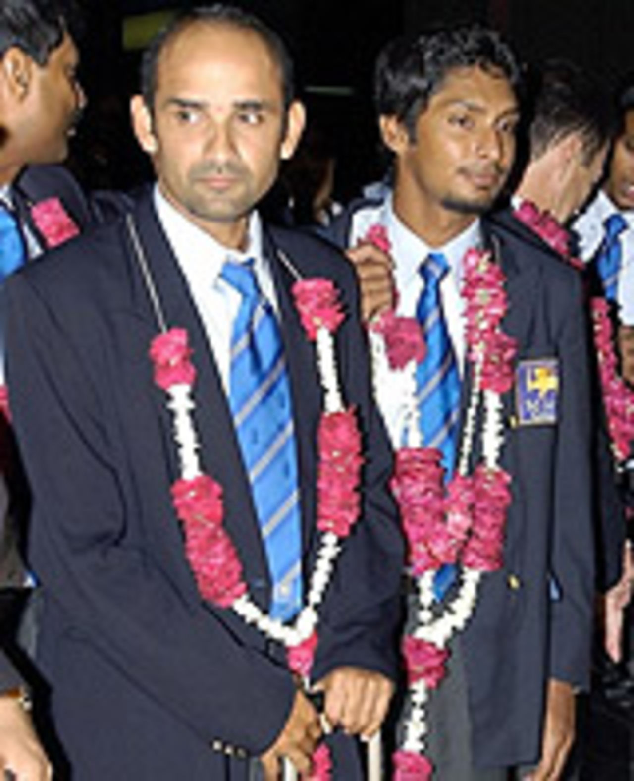 Marvan Atapattu and Kumar Sangakkara are garlanded as they arrive in Pakistan, October 4, 2004