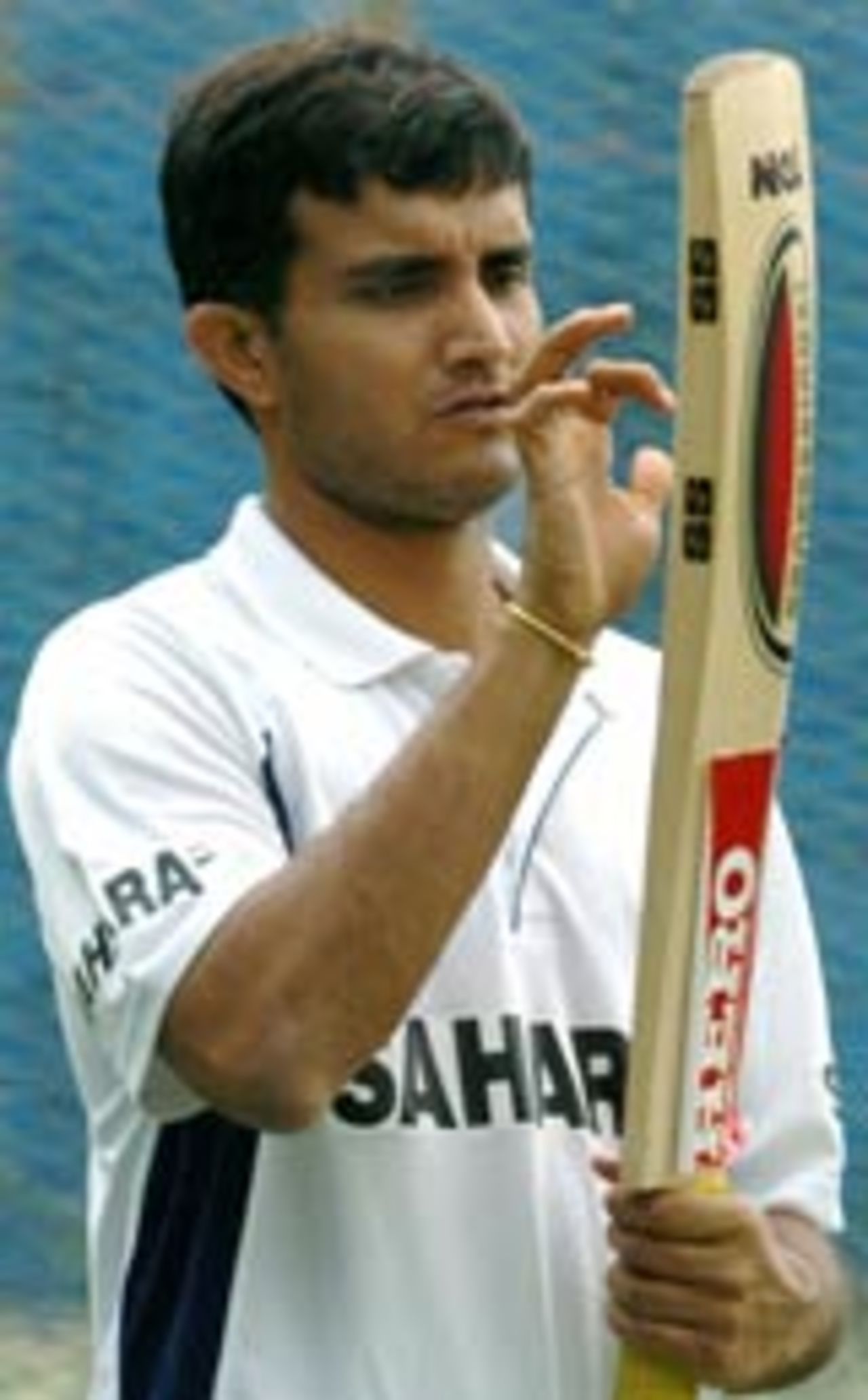 Sourav Ganguly examines his bat ahead of the Bangalore Test against Australia
