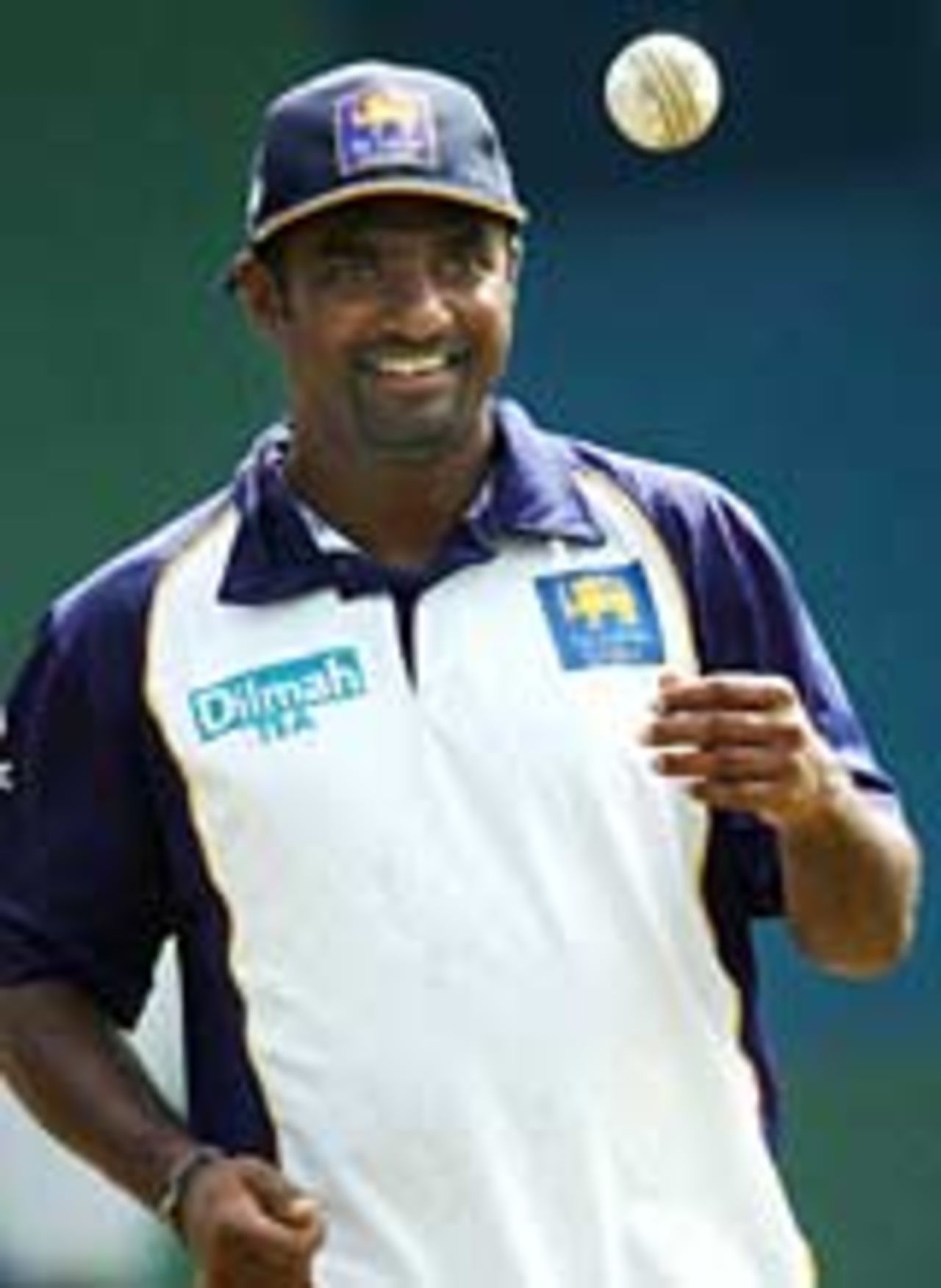 Muttiah Muralitharan flicks up a ball in practice, 2004