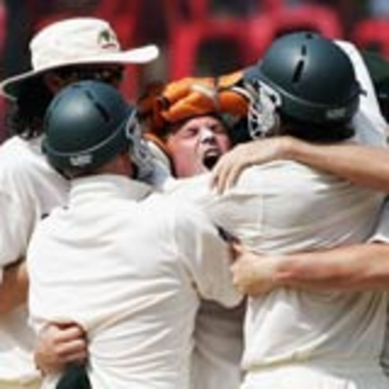 Shane Warne is hugged after he picked up the vital wicket of VVS Laxman, India v Australia, 1st Test, Bangalore, 3rd day, October 9, 2004