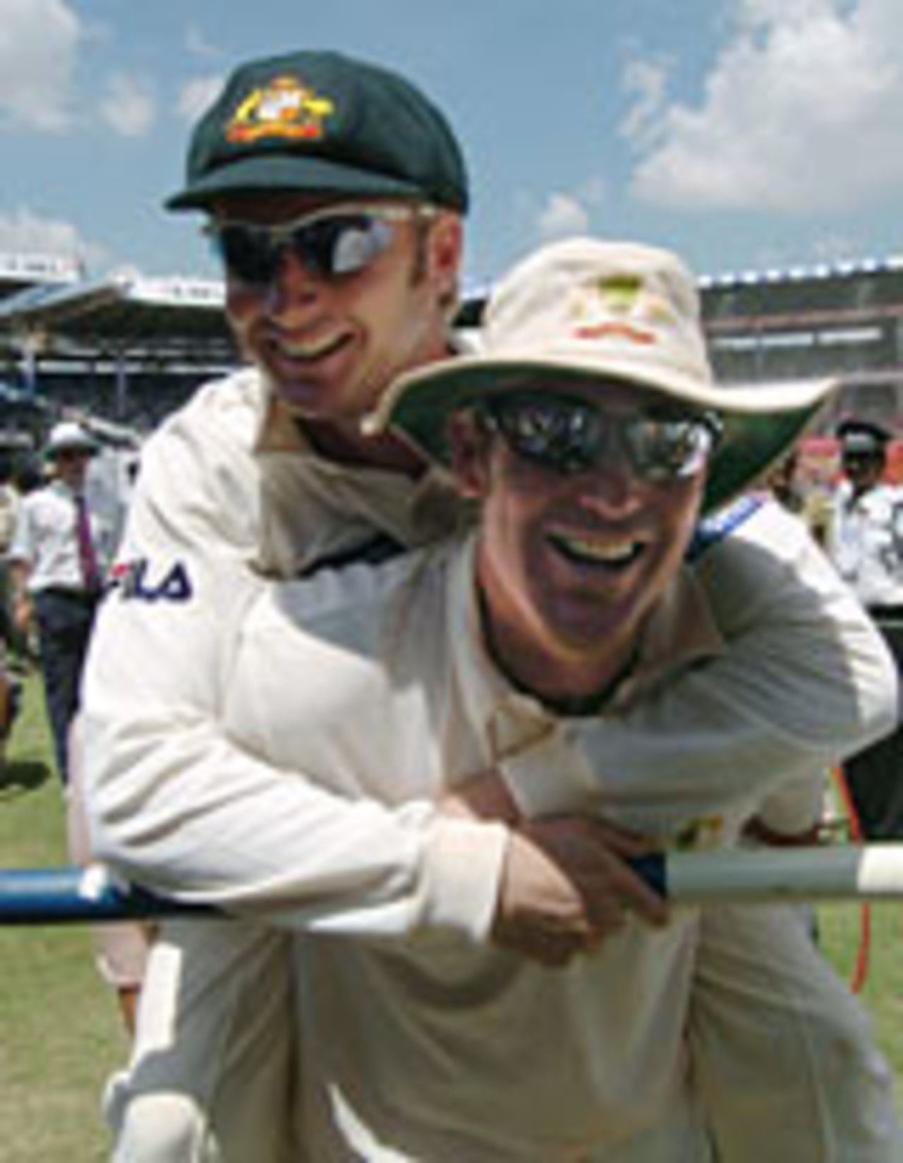 Shane Warne carries Michael Clarke as Australia celebrate victory, India v Australia, 1st Test, Bangalore, 5th day, October 10, 2004
