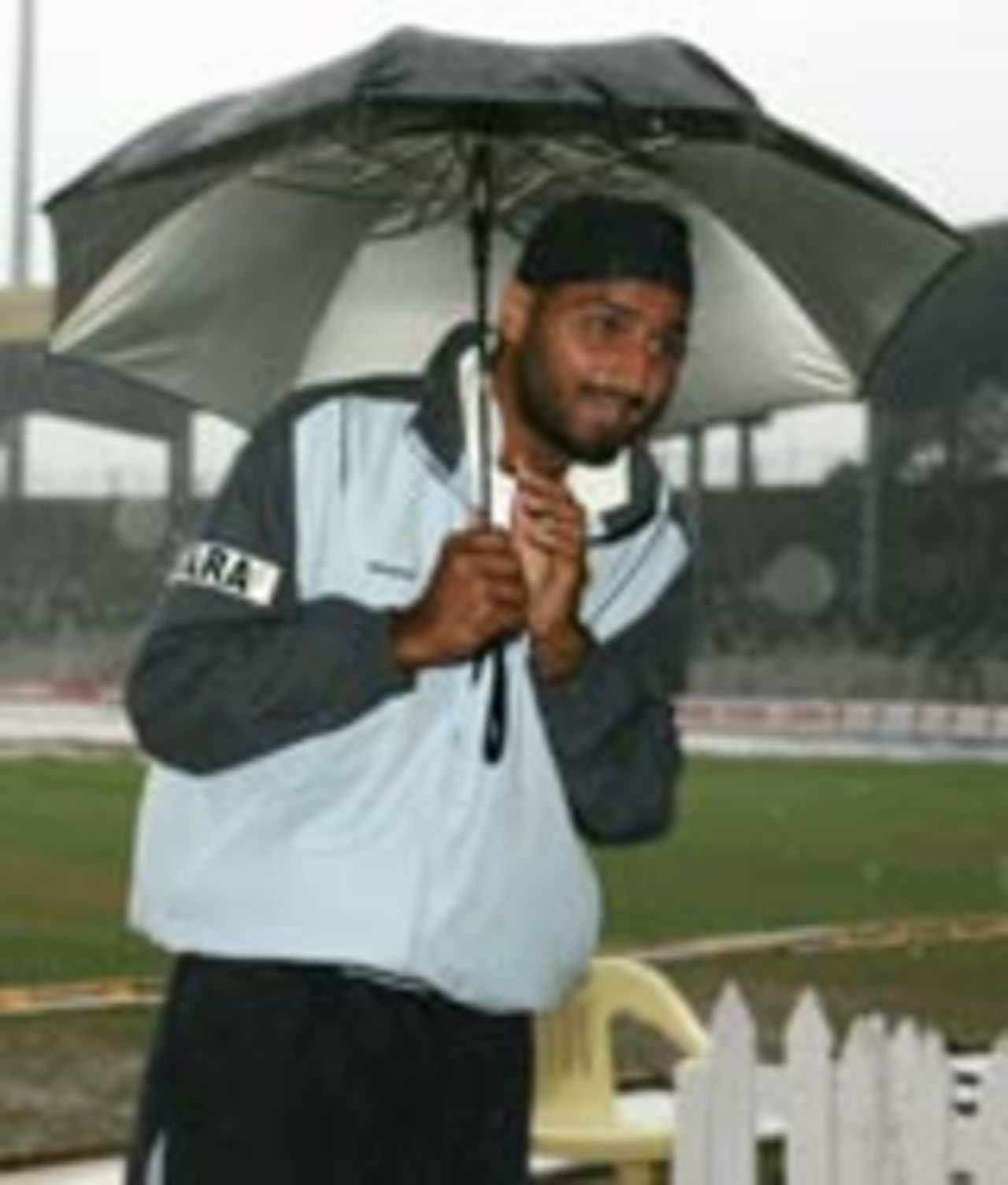 Harbhajan Singh under an umbrella in rainy Chennai, India v Australia, 2nd Test, Chennai, 5th day, October 18, 2004