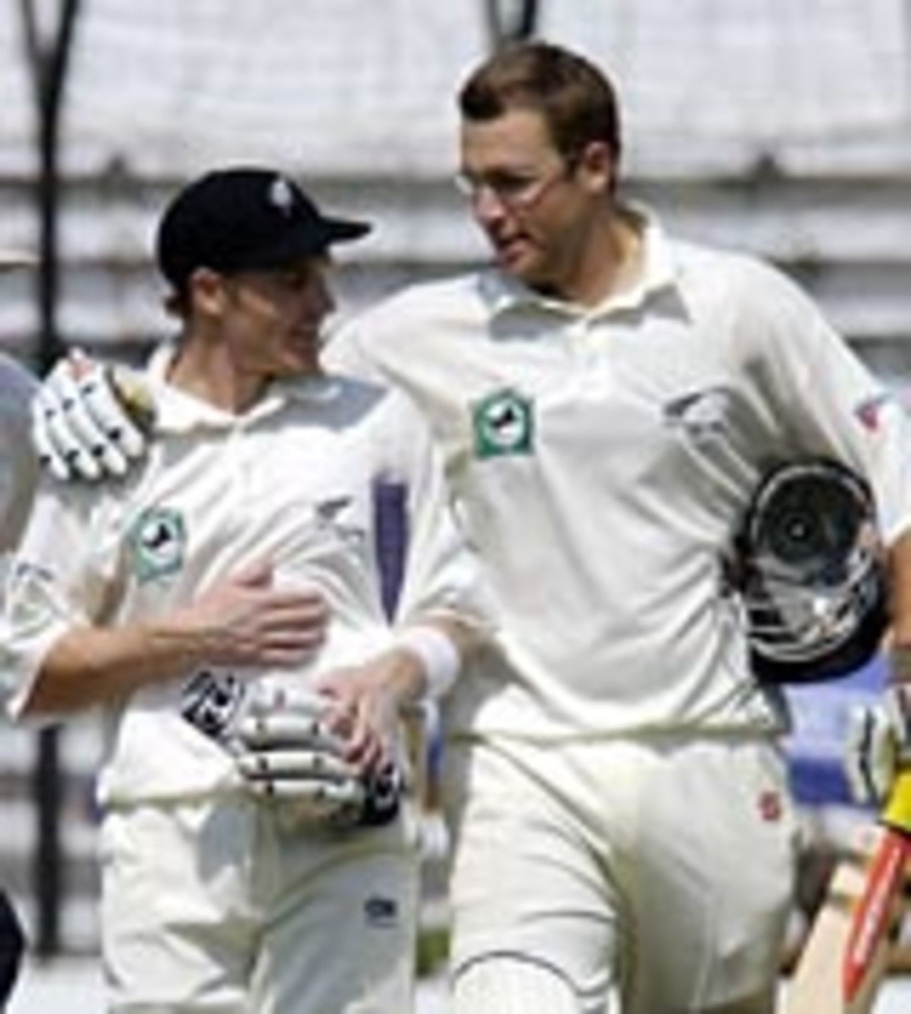 Daniel Vettori congratulates Brendon McCullum on his century, Bangladesh v New Zealand, 1st Test, Dhaka, October 21, 2004