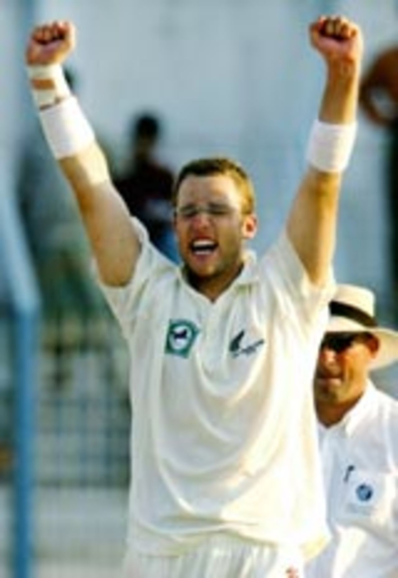 Daniel Vettori with both arms raised after taking a wicket, Bangladesh v New Zealand, 2nd Test, 4th day, Chittagong, October 29, 2004