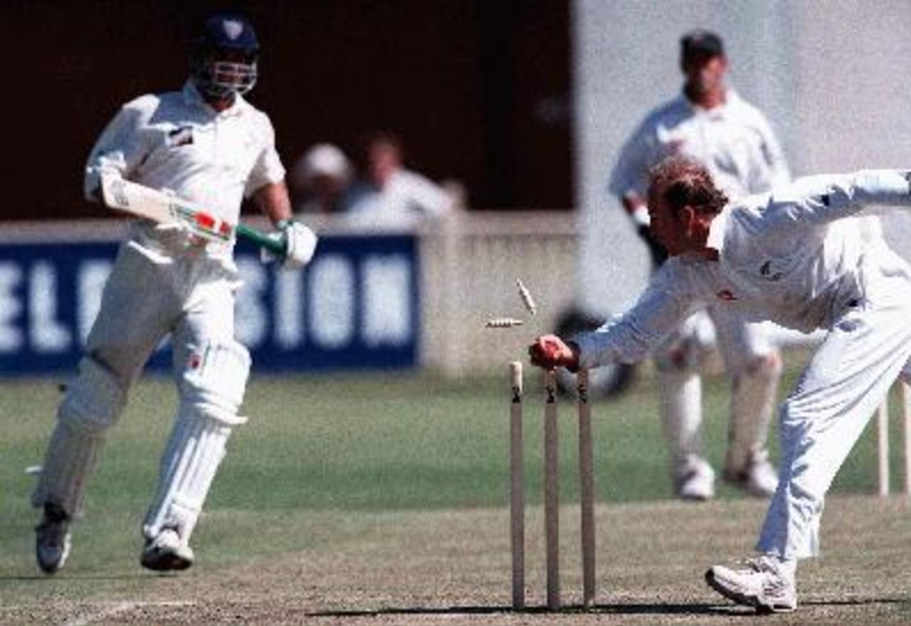 Century maker, Michael Bevan is well short as Chris Harris breaks the stumps to effect the run-out. NSW v NZ at Newcastle Oval, Day 2, Saturday November 1st 1997