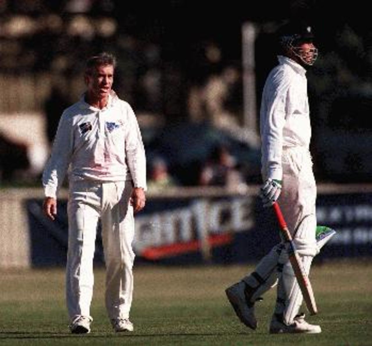 Matthews chats with Fleming after having him caught. NSW v NZ at Newcastle, Day 2, Saturday November 1st 1997