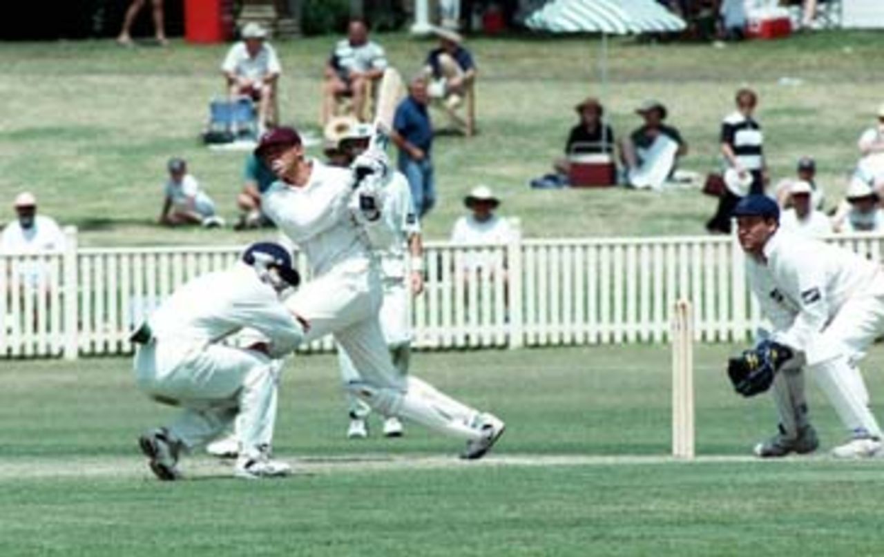 Andrew Symonds hits Stuart MacGill for 6 during the Sheffield Shield match between NSW and Queensland at Newcastle. 16th Nov 1997