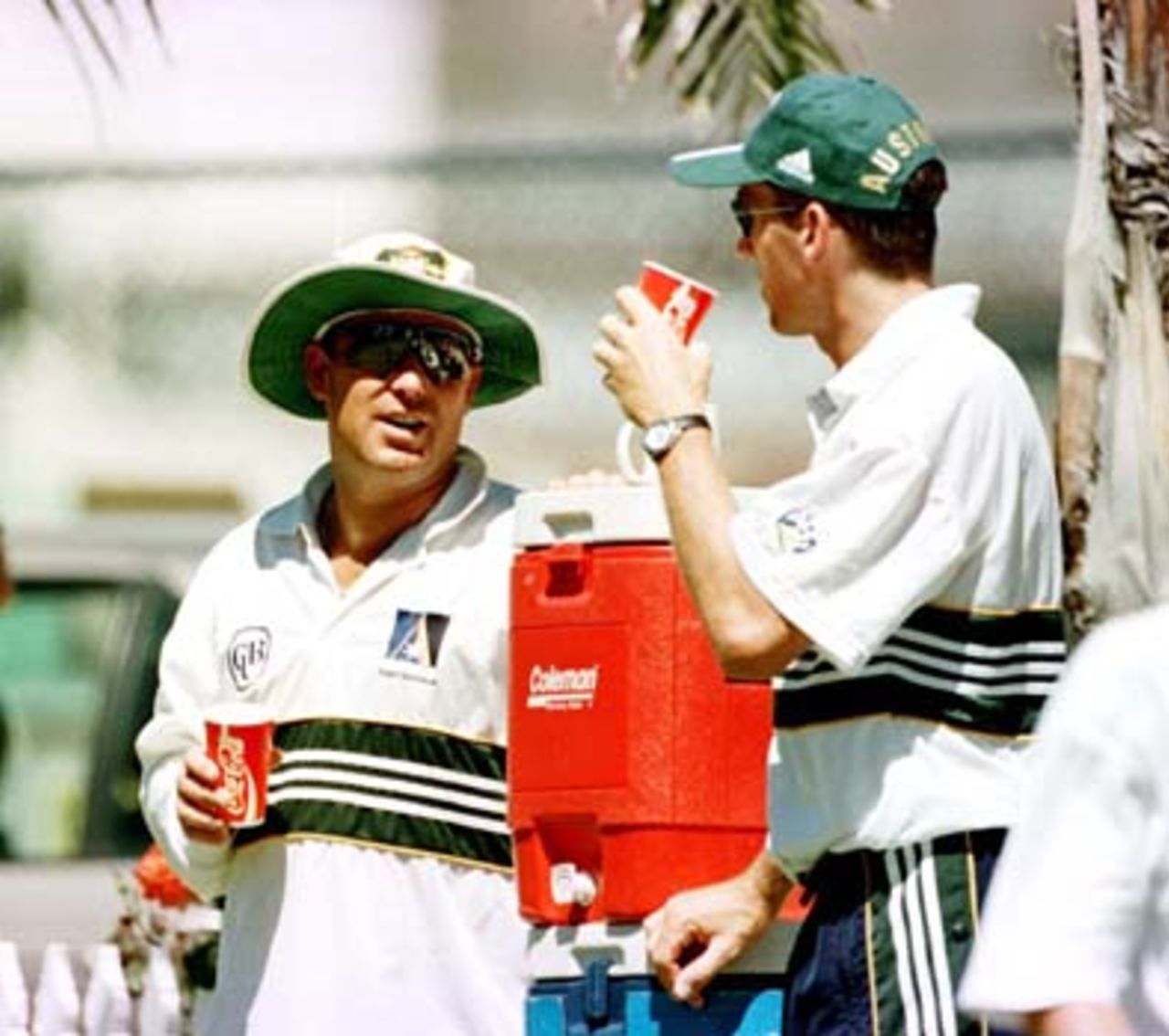 Shane Warne chats at the water cooler with the injured Glenn McGrath. Australian team practice at the WACA, Perth, Wednesday November 19th 1997.