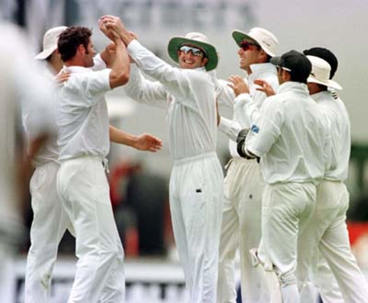 Kiwi players line up to congratulated Chris Cairns (2nd from left) after he dismissed Ricky Ponting. Australia v New Zealand 2nd Test, Day Three, at the WACA, Perth, Thursday November 22nd 1997