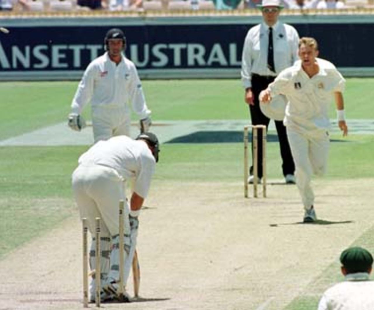 Cook removes Cairns's off stump . Australia v New Zealand 2nd Test, Day Four, at the WACA, Perth, Thursday November 23rd 1997