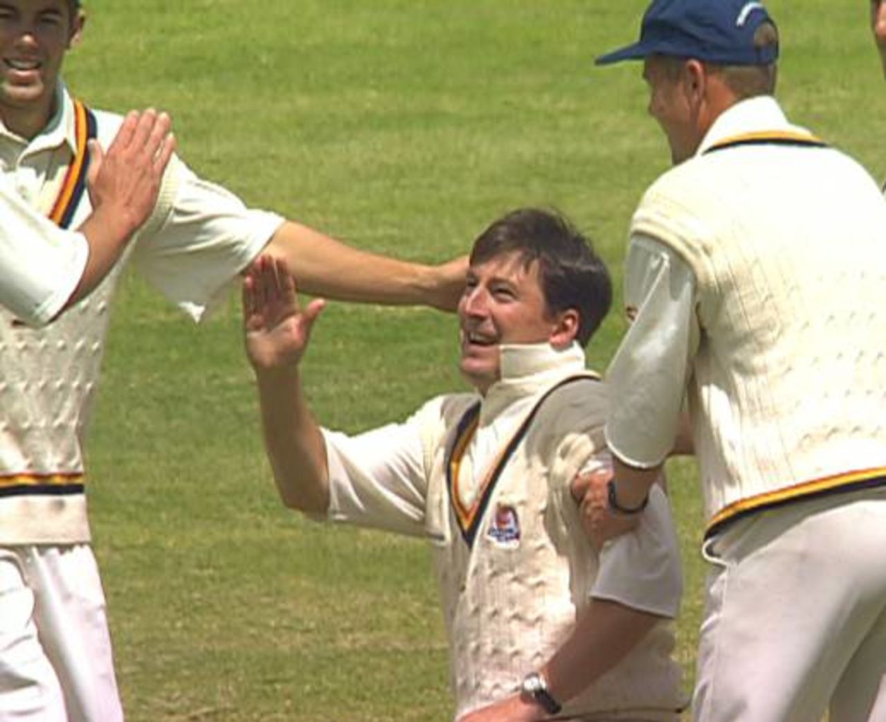 Ken Rutherford is congratulated by his Gauteng team-mates after taking a superb diving catch in the gully to dismiss Eric Simons during the SuperSport Series match against Western Province, 22 Nov 1997.