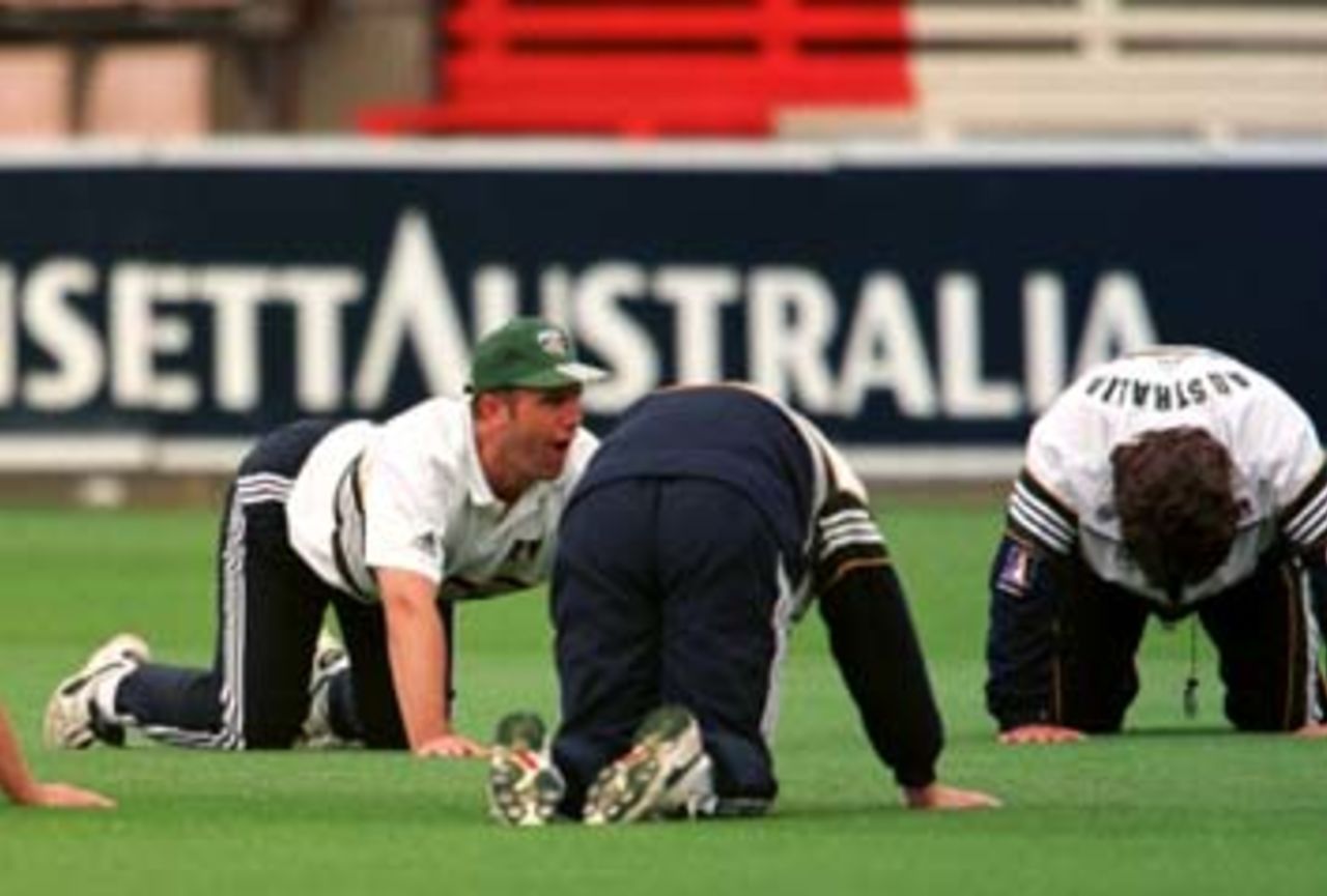 Mark Taylor does his best to imitate a dog before the 1st rain shortened day of the 3rd Test between Australia and New Zealand at Bellerive Oval, Hobart, Tasmania. 27 November 1997.