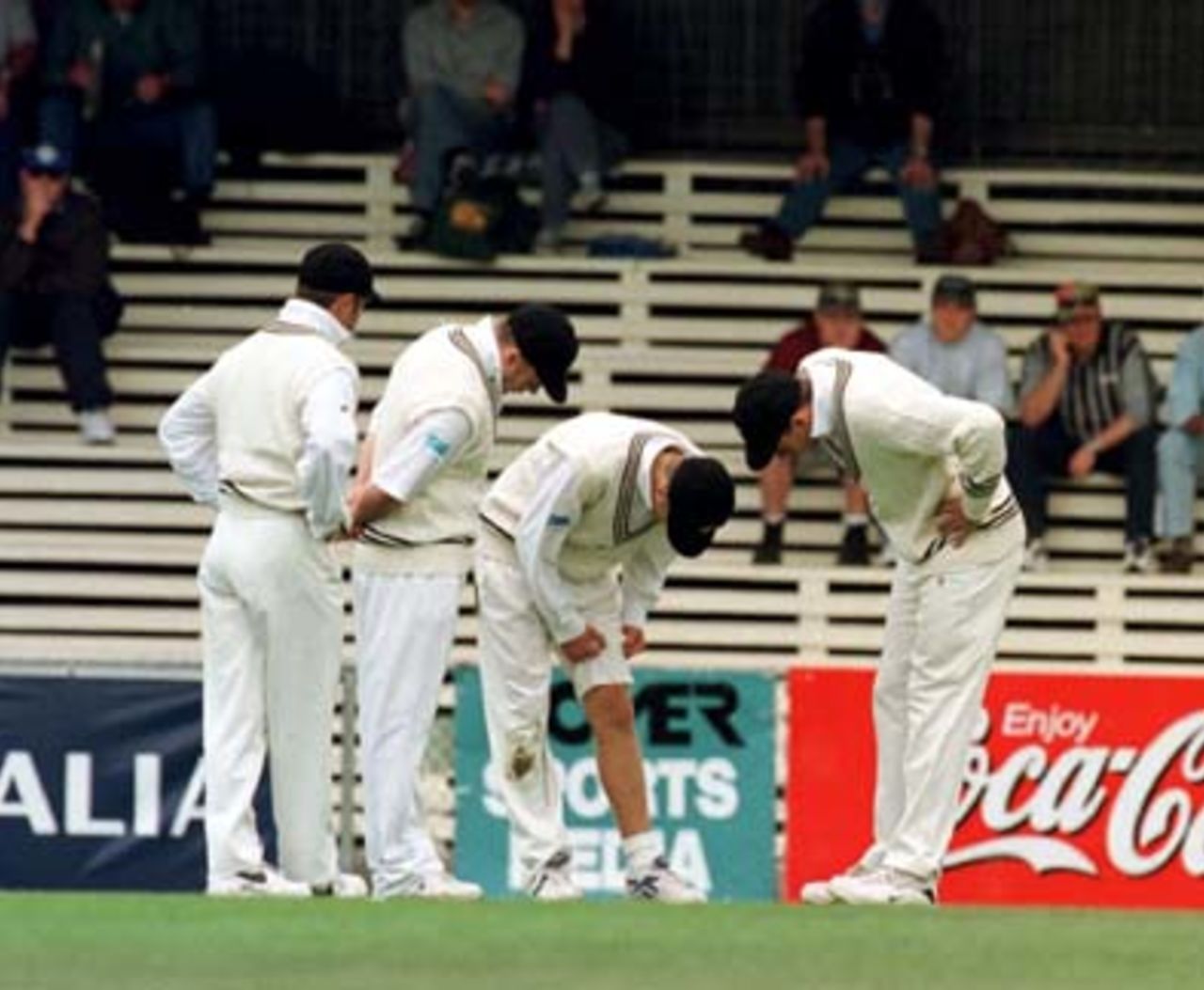 The Kiwis check out Vettori's injured leg before he was taken to hospital for X-Rays during the 2nd day of the 3rd Test between Australia and New Zealand at Bellerive Oval in Tasmania. 28 November 1997
