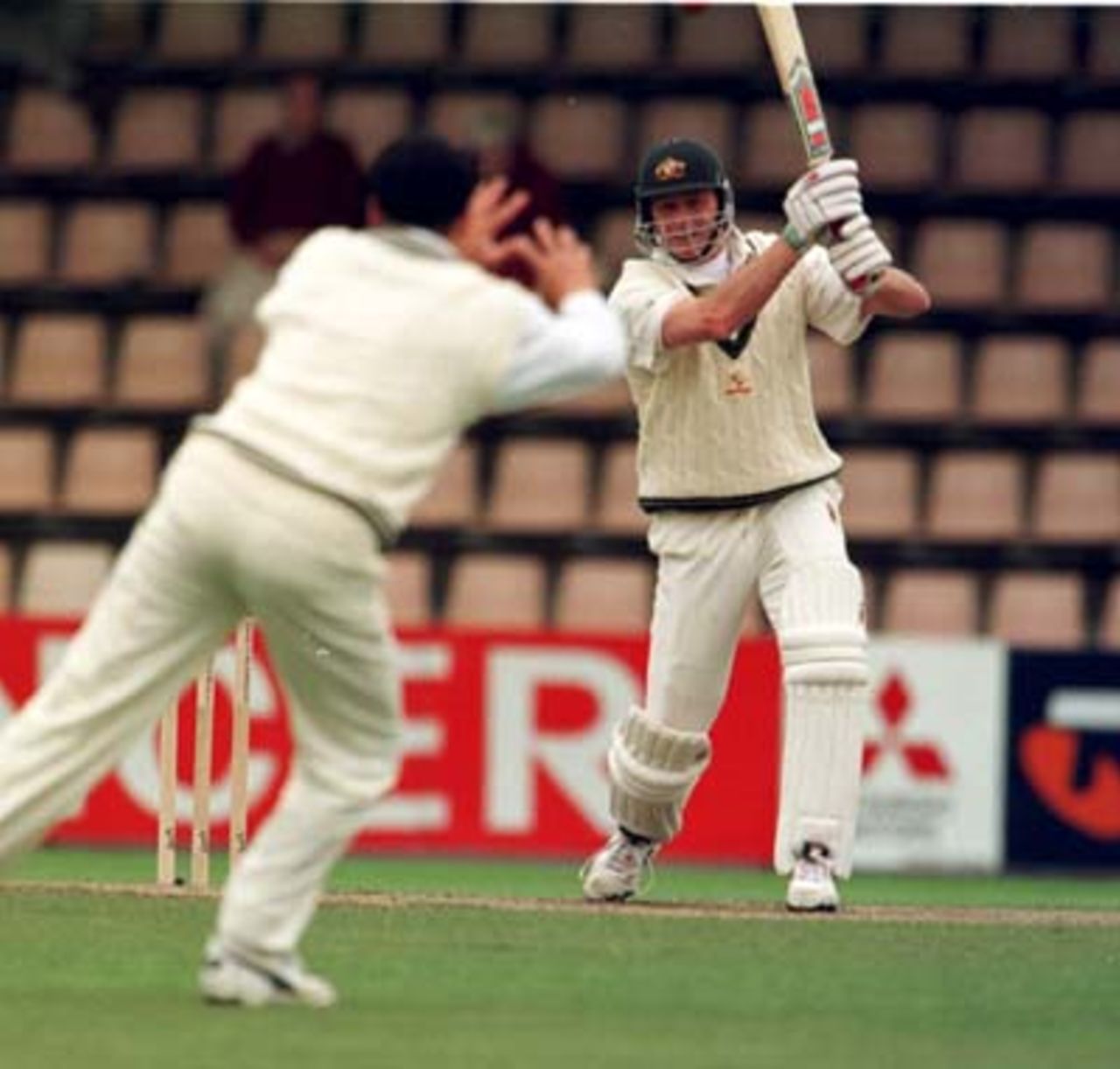 Paul Reiffel grimaces as Bryan Young moves to catch him out during the rain shortened 3rd day of the 3rd Test between Australia and New Zealand at Bellerive Oval in Hobart, Tasmania. November 29th 1997.