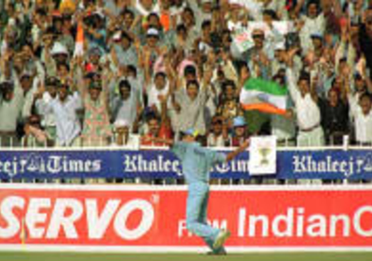 India's Ajit Agarkar celebrates with supporters the dismissal of Zimbabwe's Grant Flower during the final of the Cocal Cola Trophy in Sharjah, United Arab Emirates, 13 November 1998.